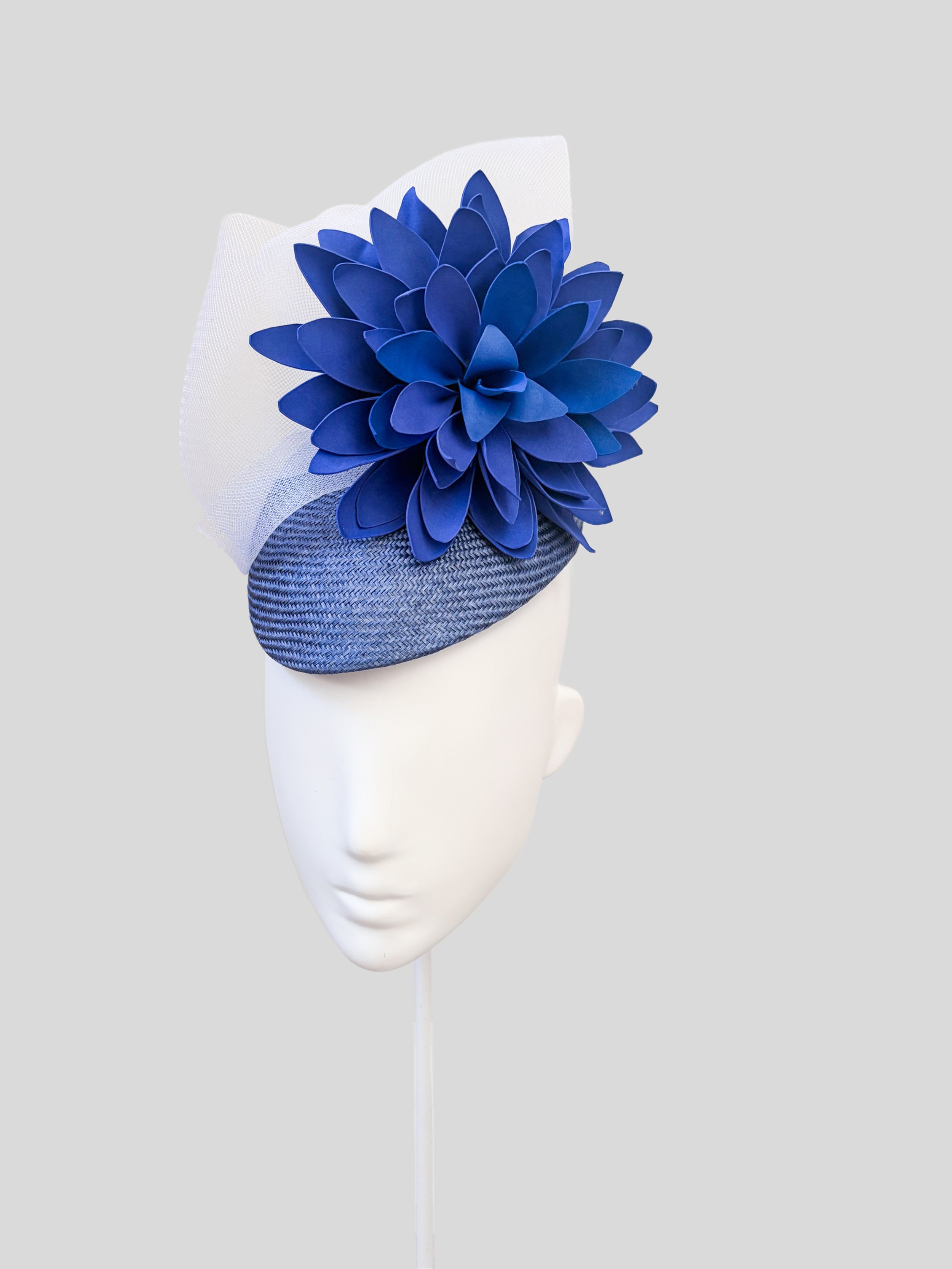 Front view of PETALIA Blue, featuring its mid-blue Parisisal base, sculptural floral detail and white crinoline.