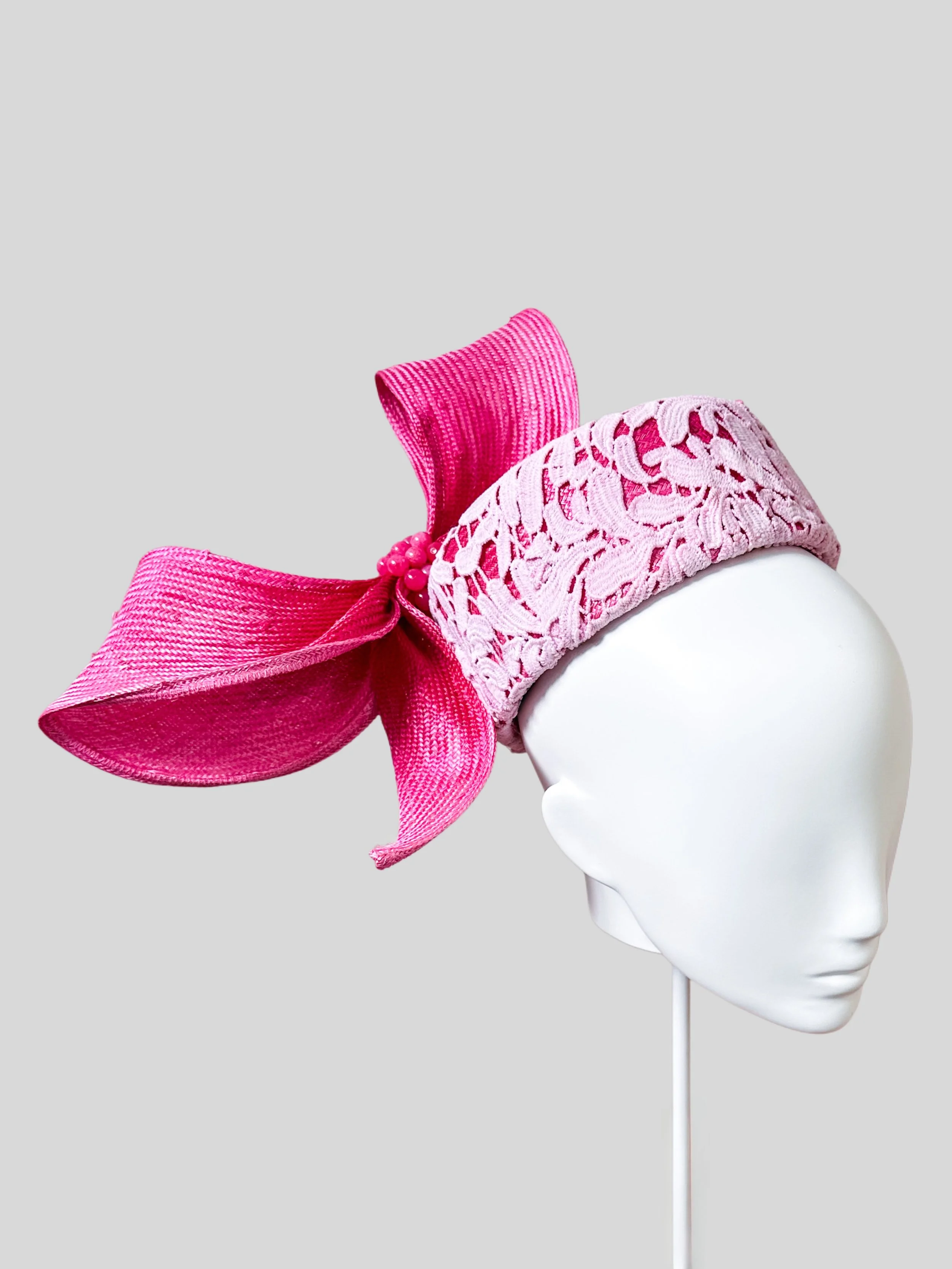 Left profile of the Ombre Lace Pillbox with Parisial Bow, revealing the elegant curvature and the beautifully designed ombre pink wired bow.