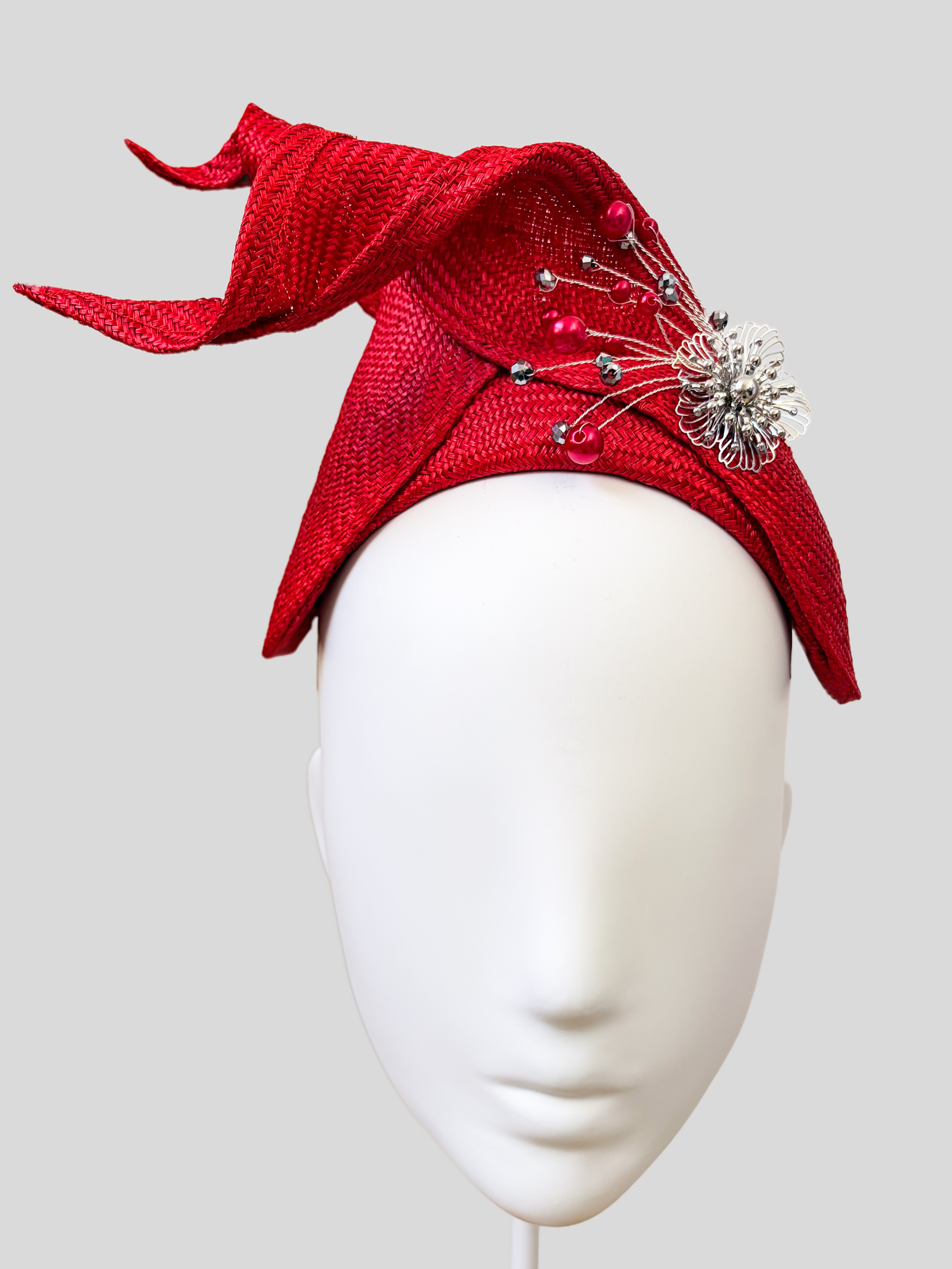 Close-up: Close-up of the hand-applied silver embellishment featuring pearls and delicate silver bead detailing on the SÉLÈNE Ruby headband.