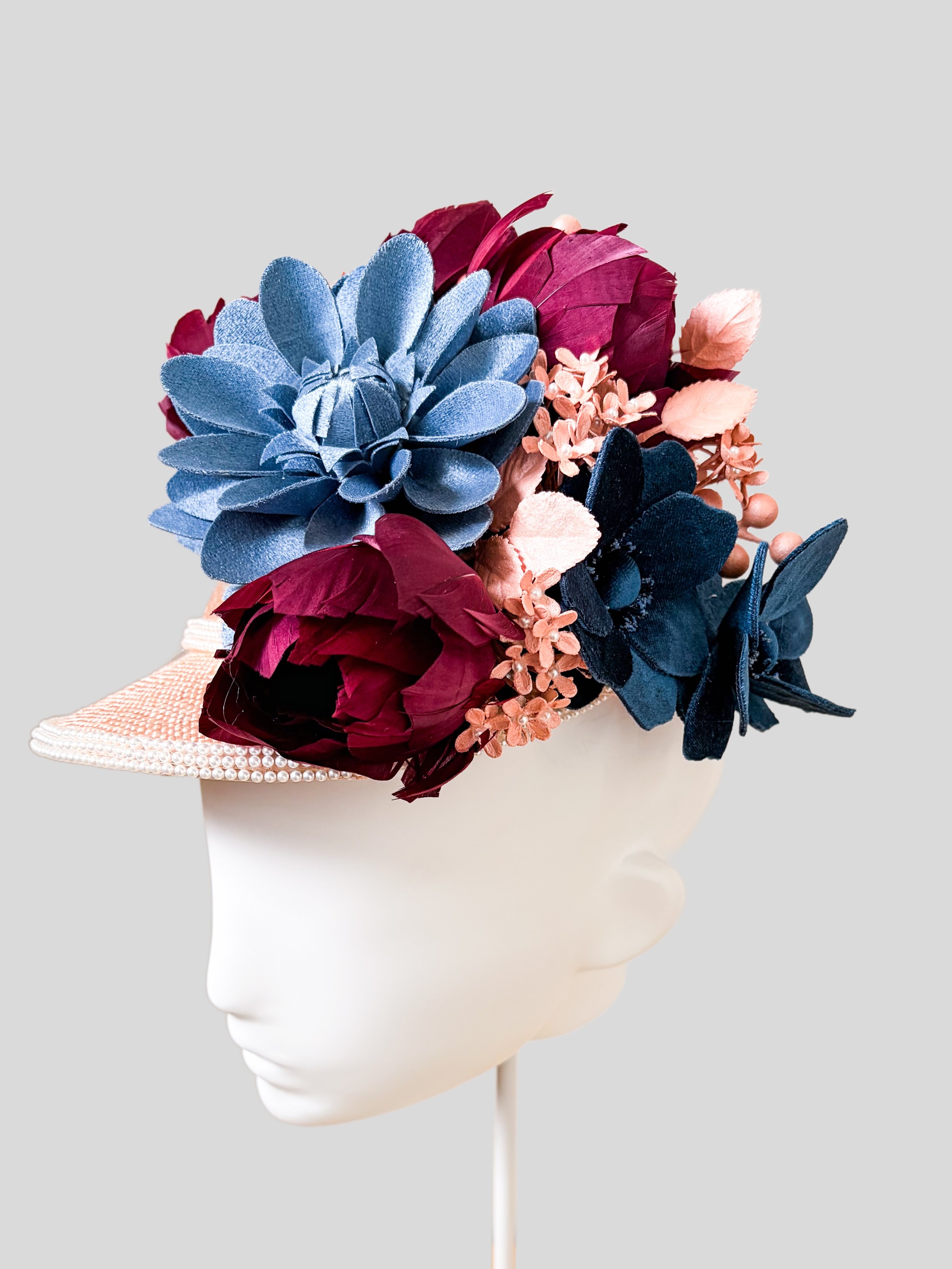 Right: Rosalie Rose floral jockey cap shown from the right side.