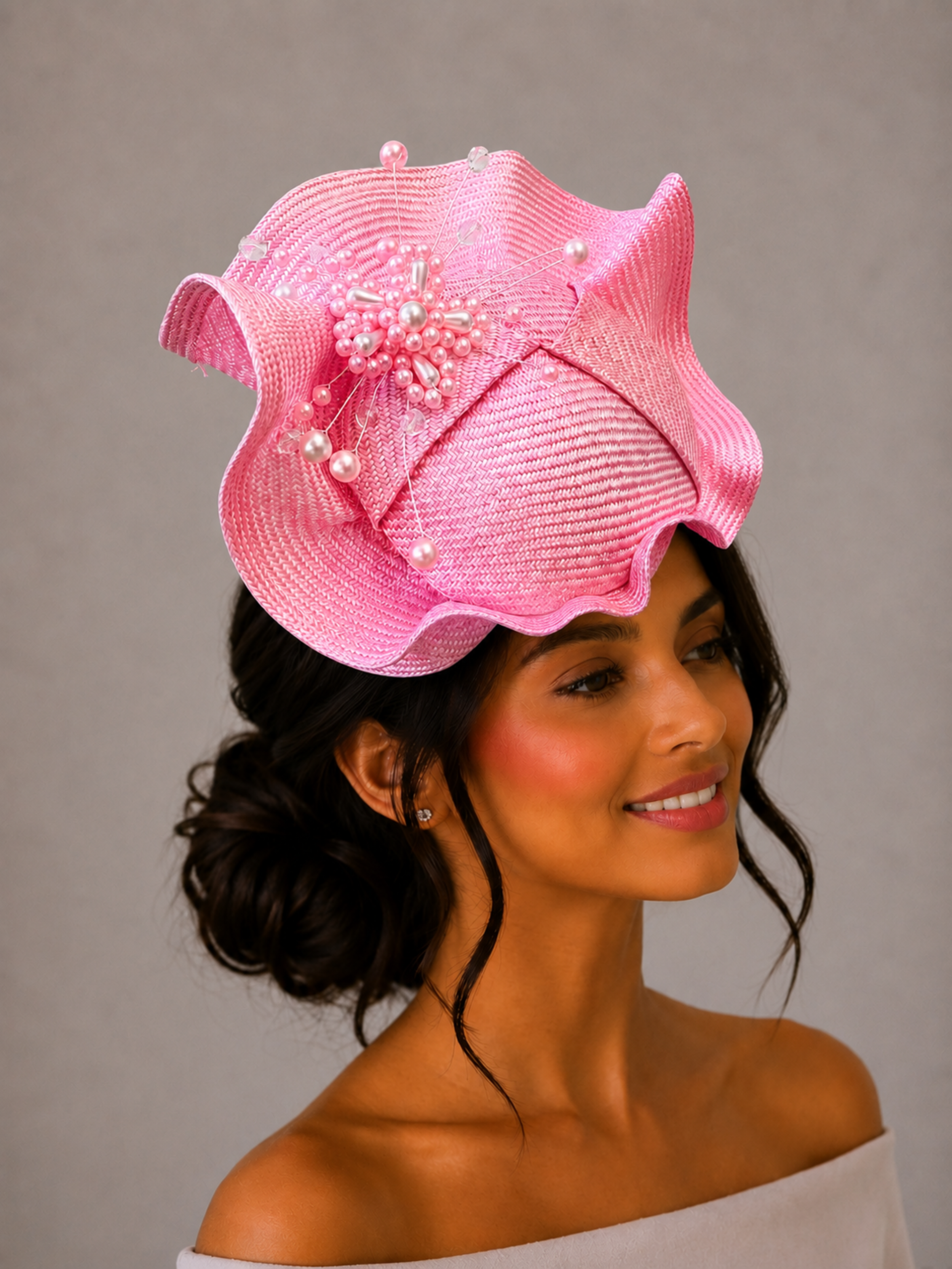 Model: VÉRA Rose Parisisal cocktail hat styled on a model, showcasing its sculptural silhouette and intricate hand-beaded embellishment.
