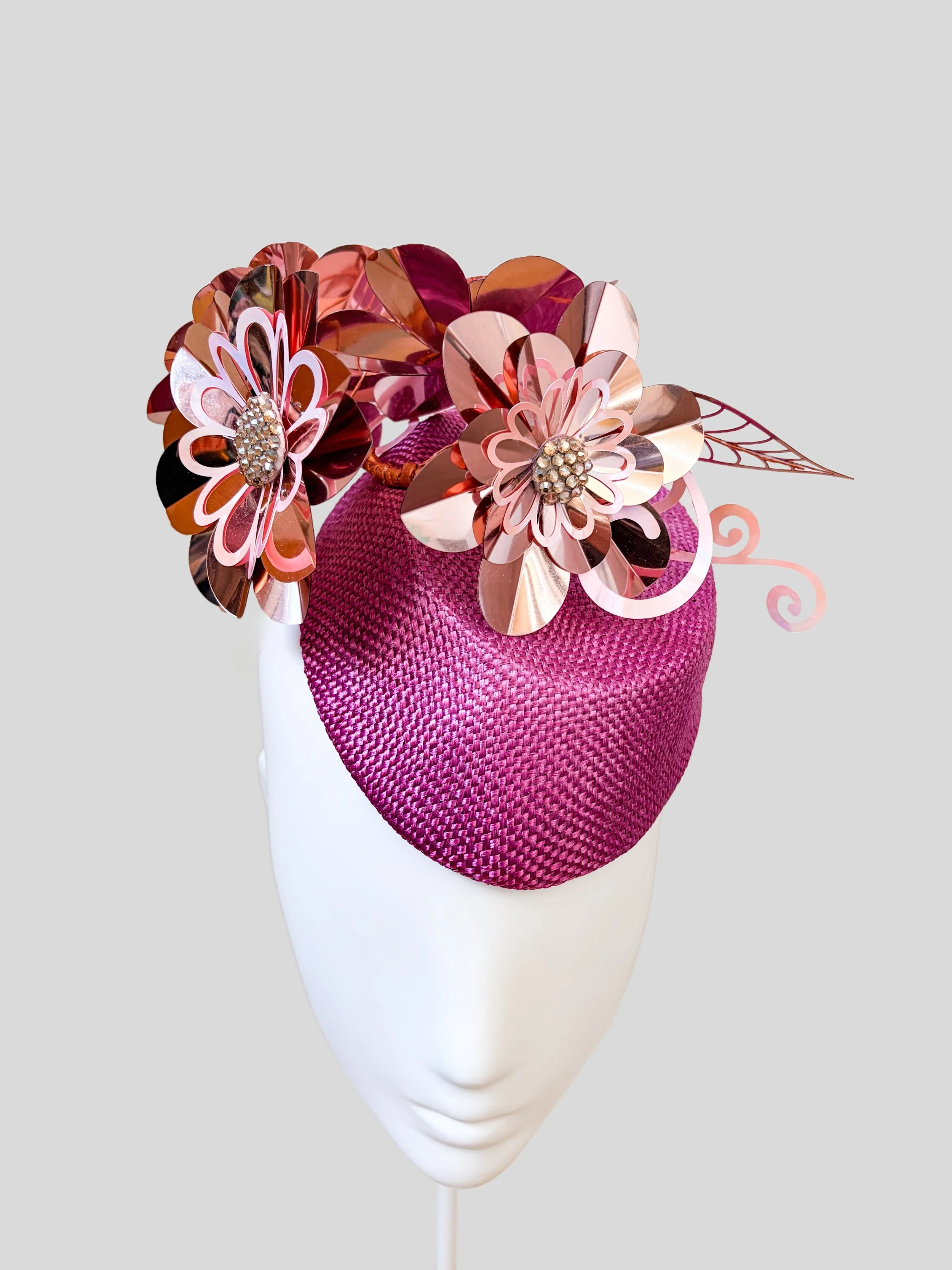 Front: Aurelia Orchid metallic floral cocktail headpiece with rose-gold adornment.