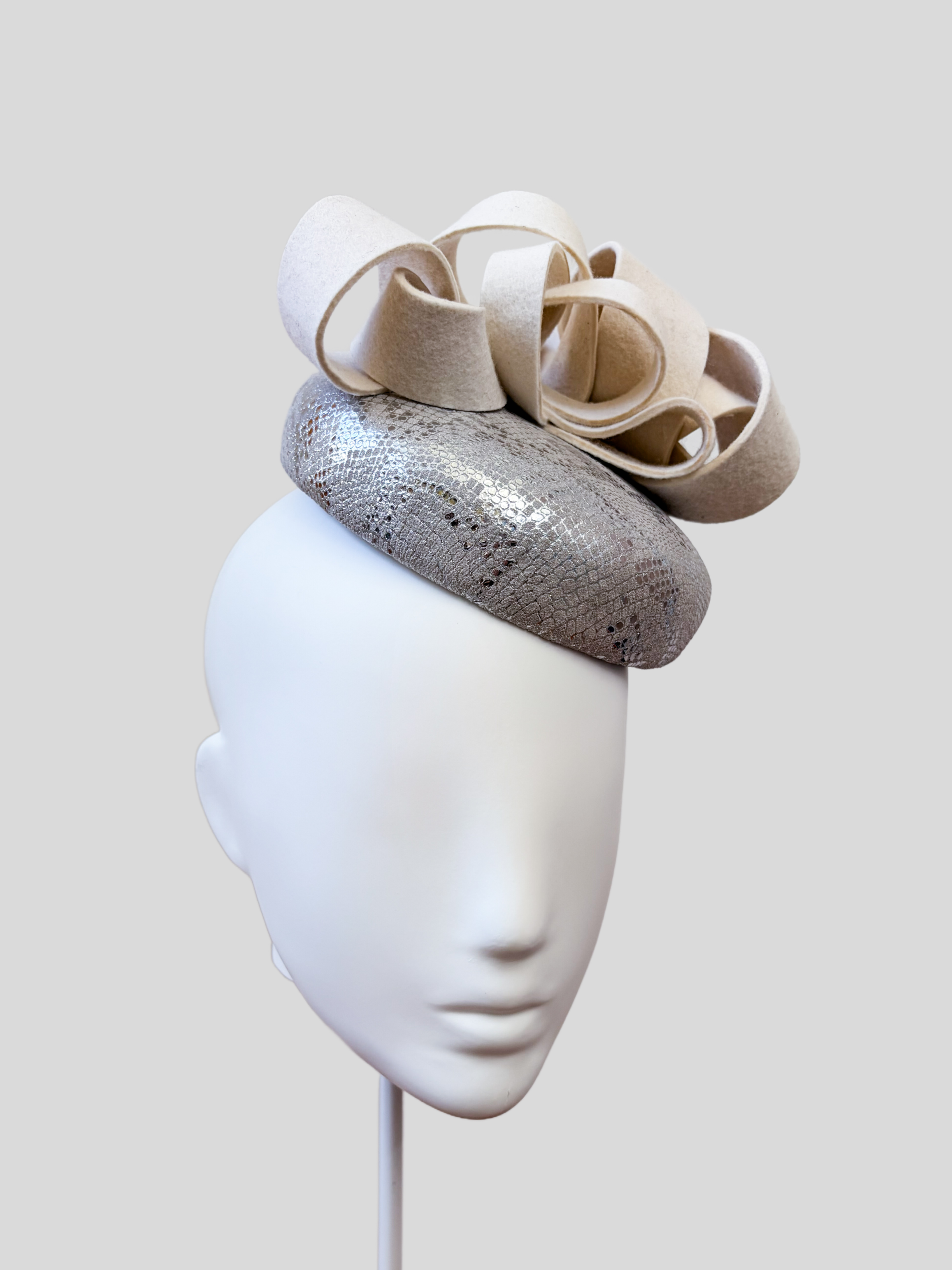 chiara-silver-white-wool-felt--leather-fascinator-left-view.jpg.png
