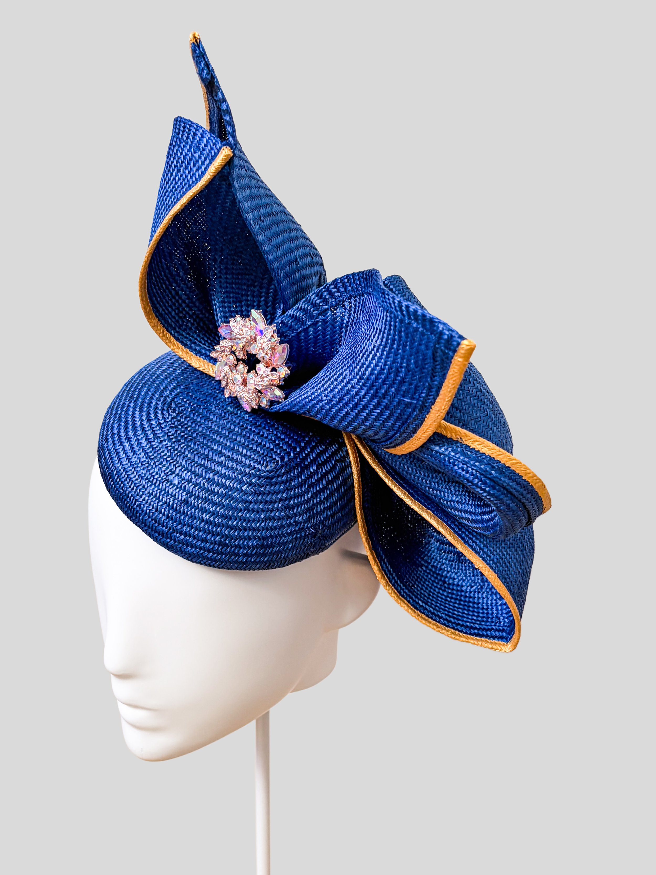 Aria Cobalt sculptural headpiece shown from the right side.