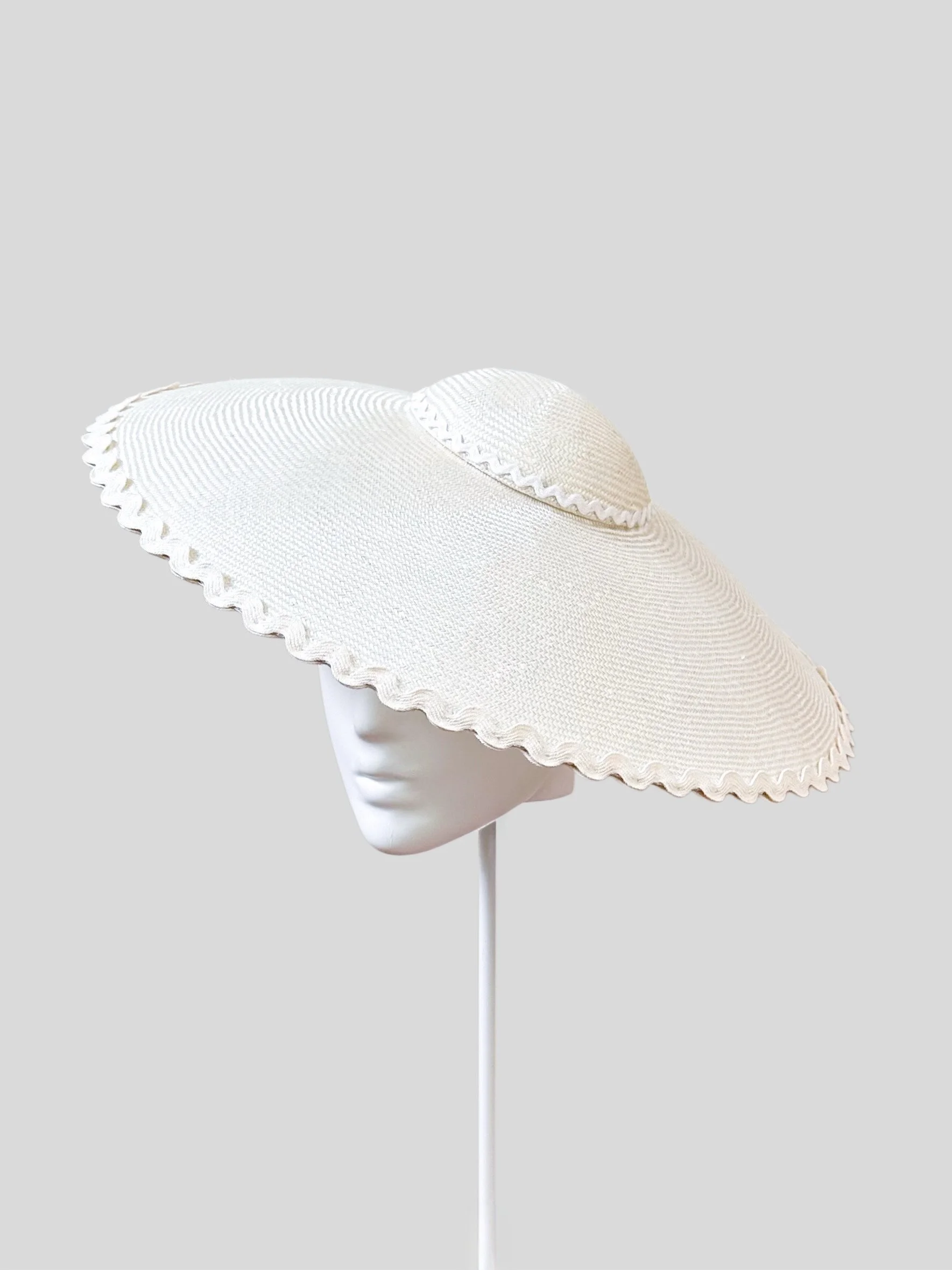 A right-side view of the Ivory Scalloped Dior Brimmed Hat, capturing the seamless flow of the classic Dior brim and the intricate scalloped design. A one-of-a-kind accessory.