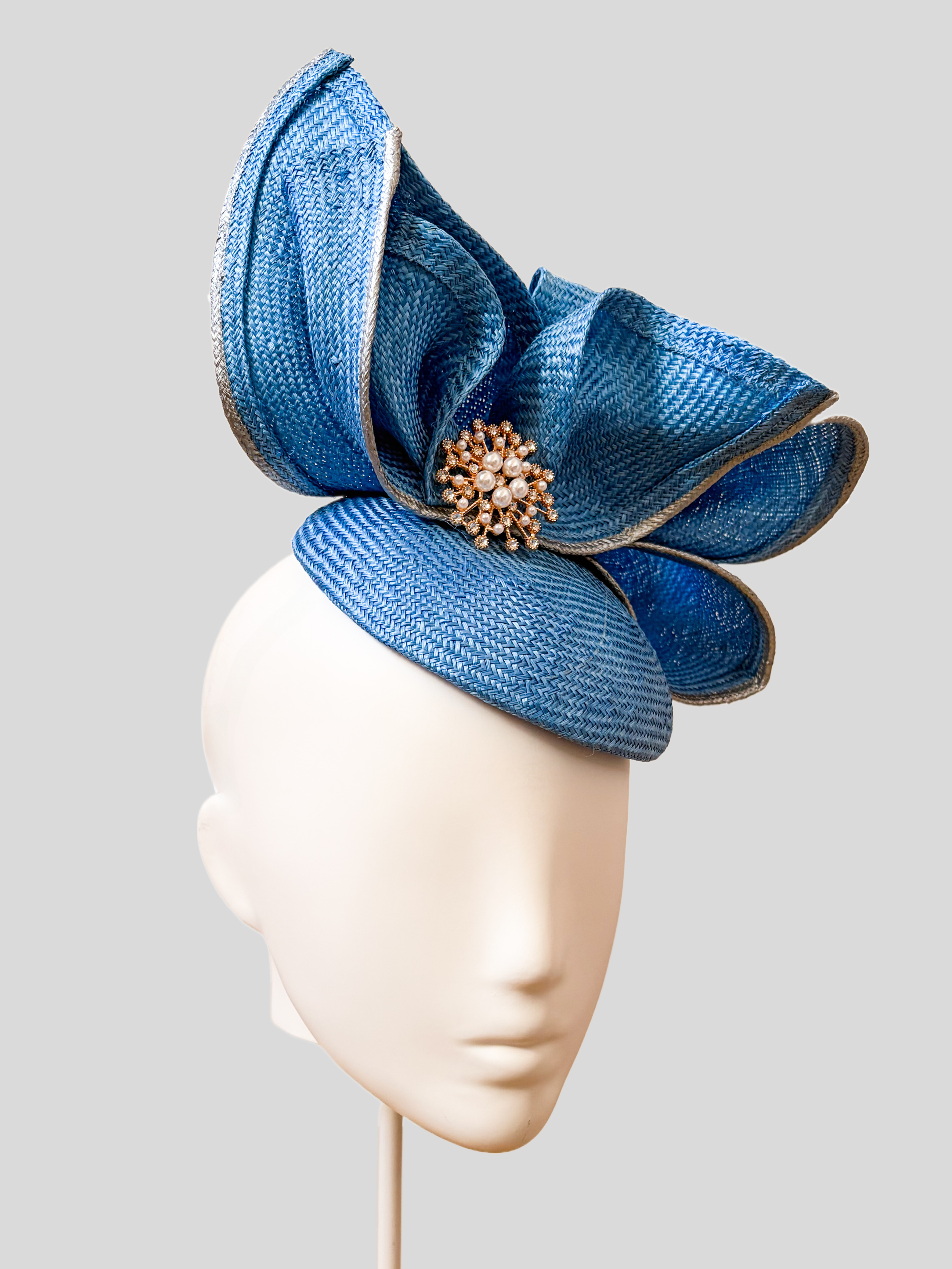 aria-sapphire-sculptural-parisisal-headpiece-left.png