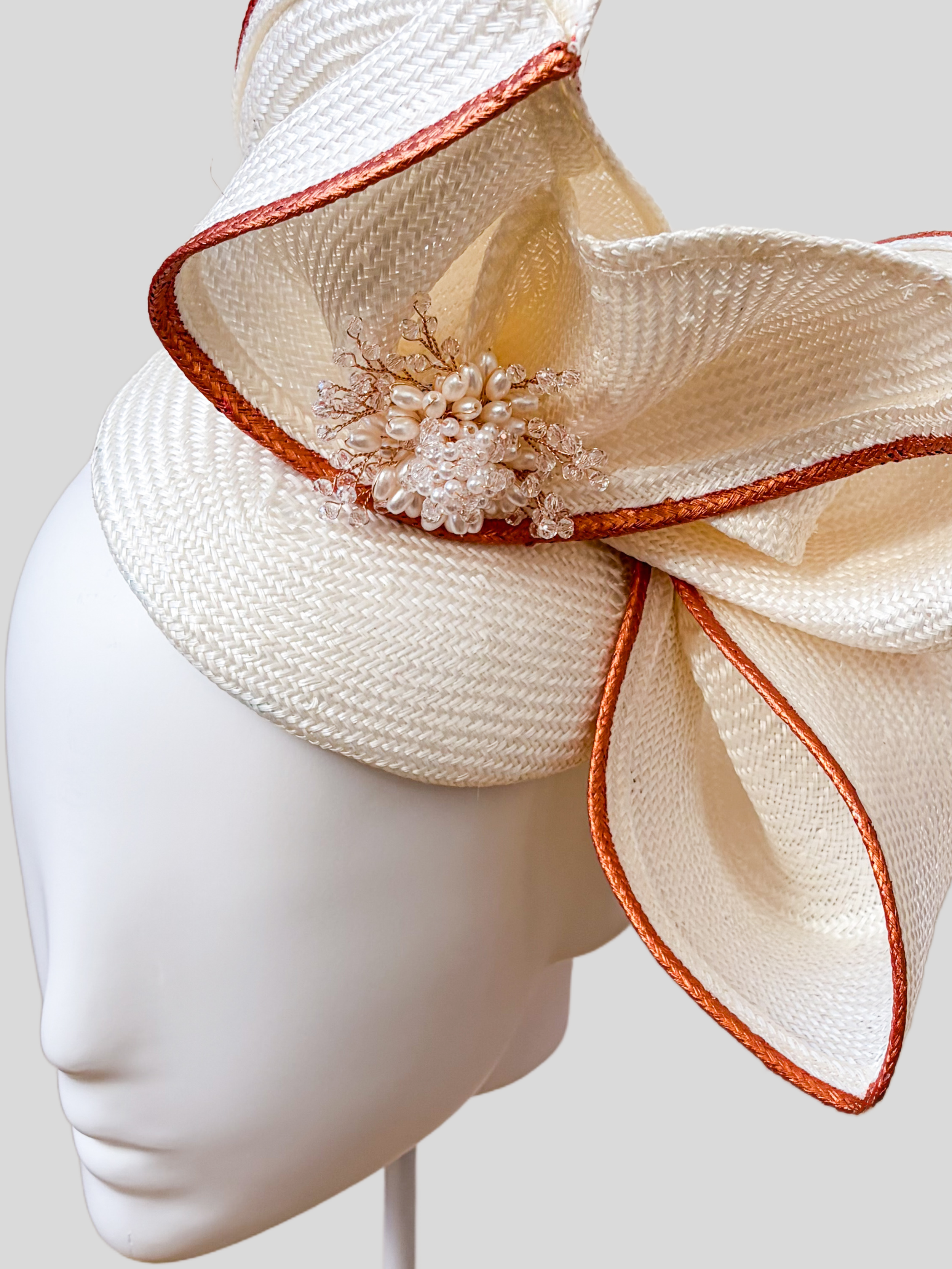 aria-ivory-sculptural-parisisal-headpiece-colse-up.png