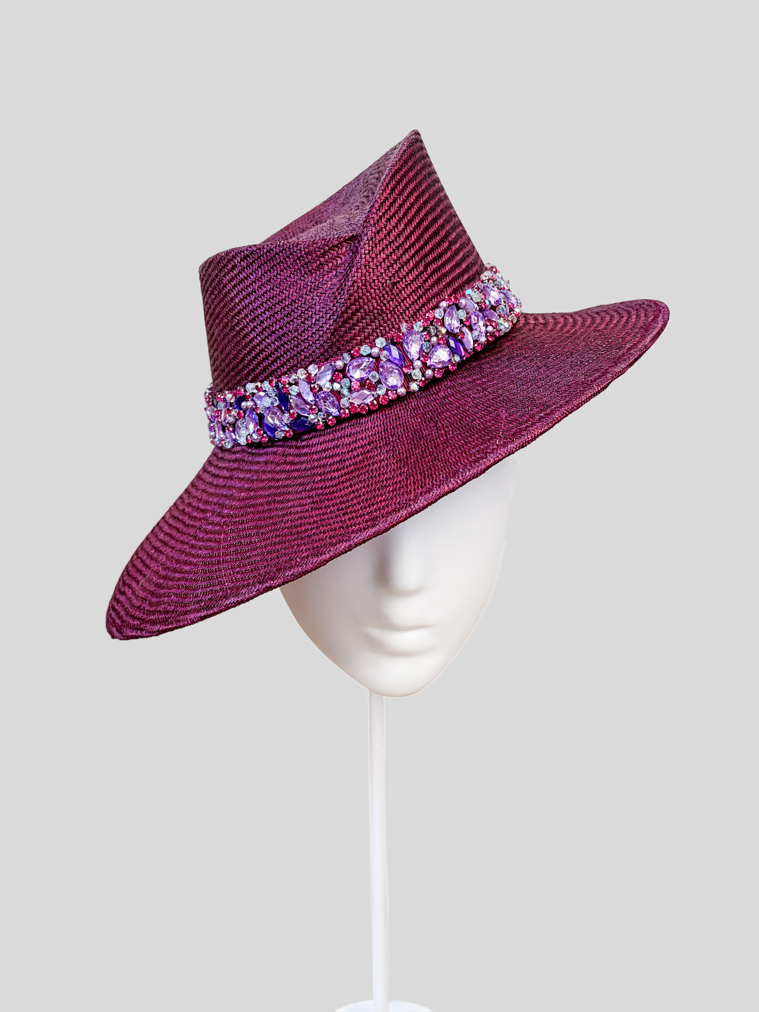 Front: MAISON Amethyst Parisisal fedora featuring a sculptural Divine Millinery block and hand-embellished purple beaded band.