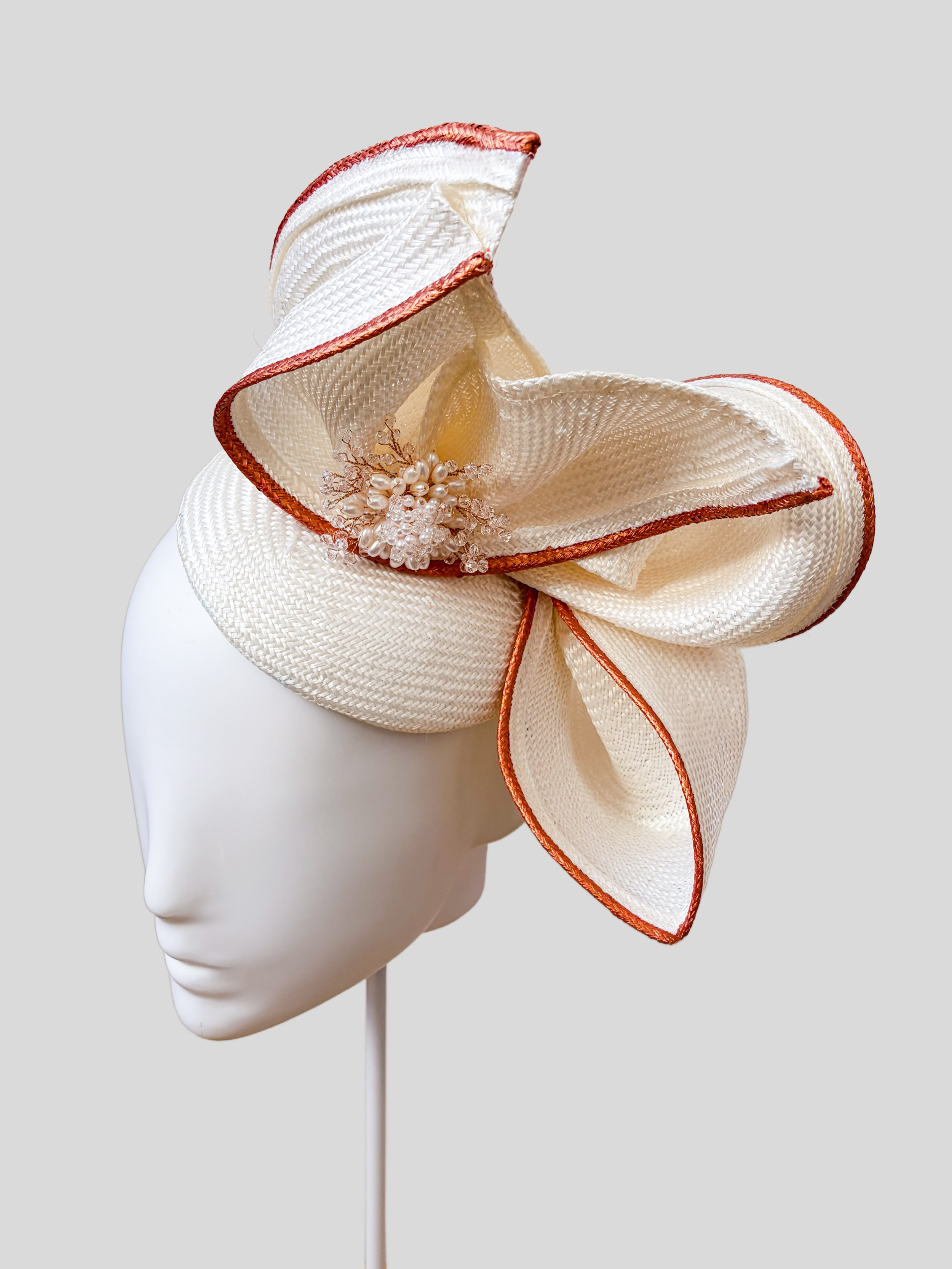 Aria Ivory sculptural headpiece shown from the right side.