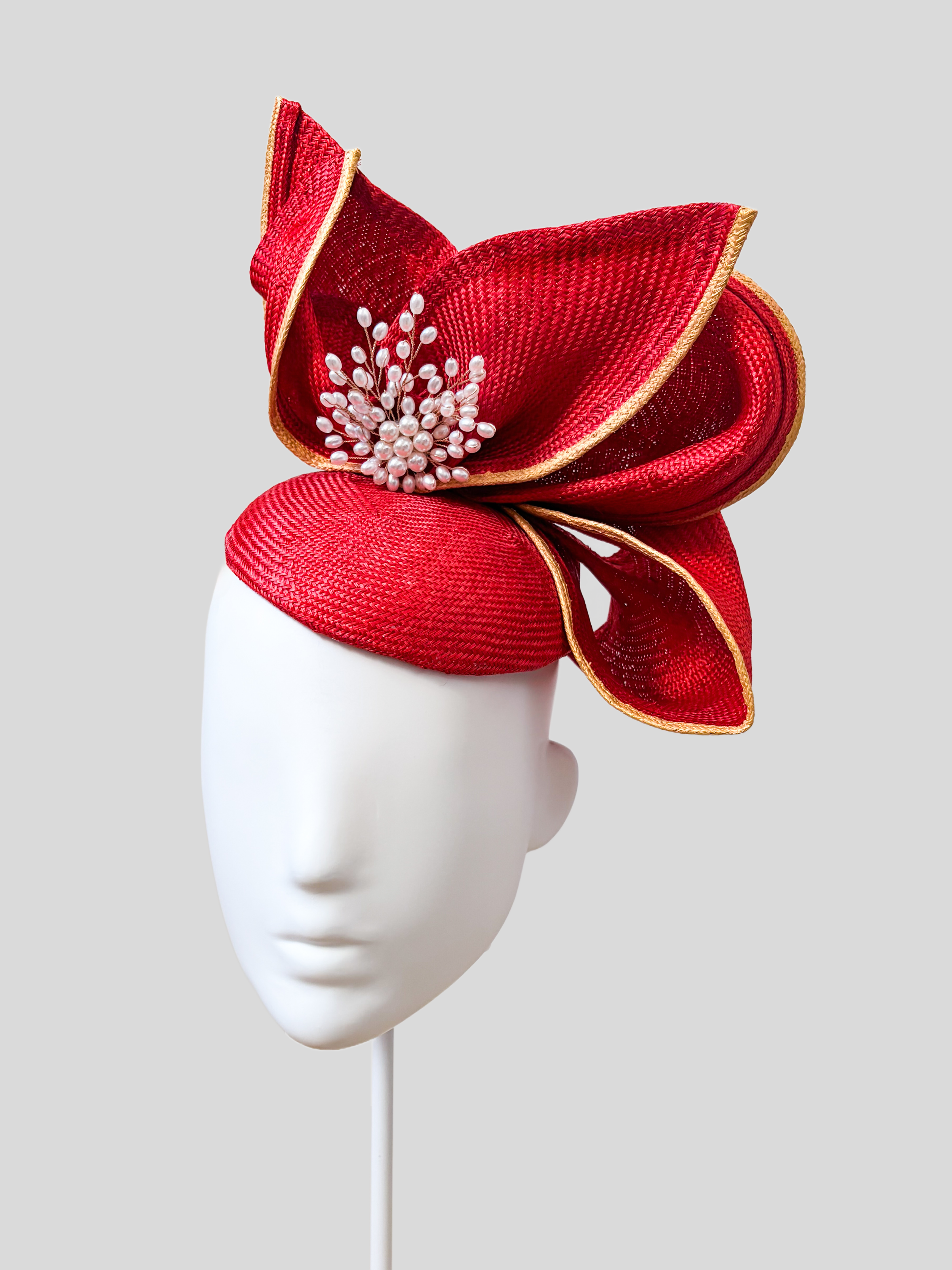 Aria Ruby sculptural headpiece shown from the right side.