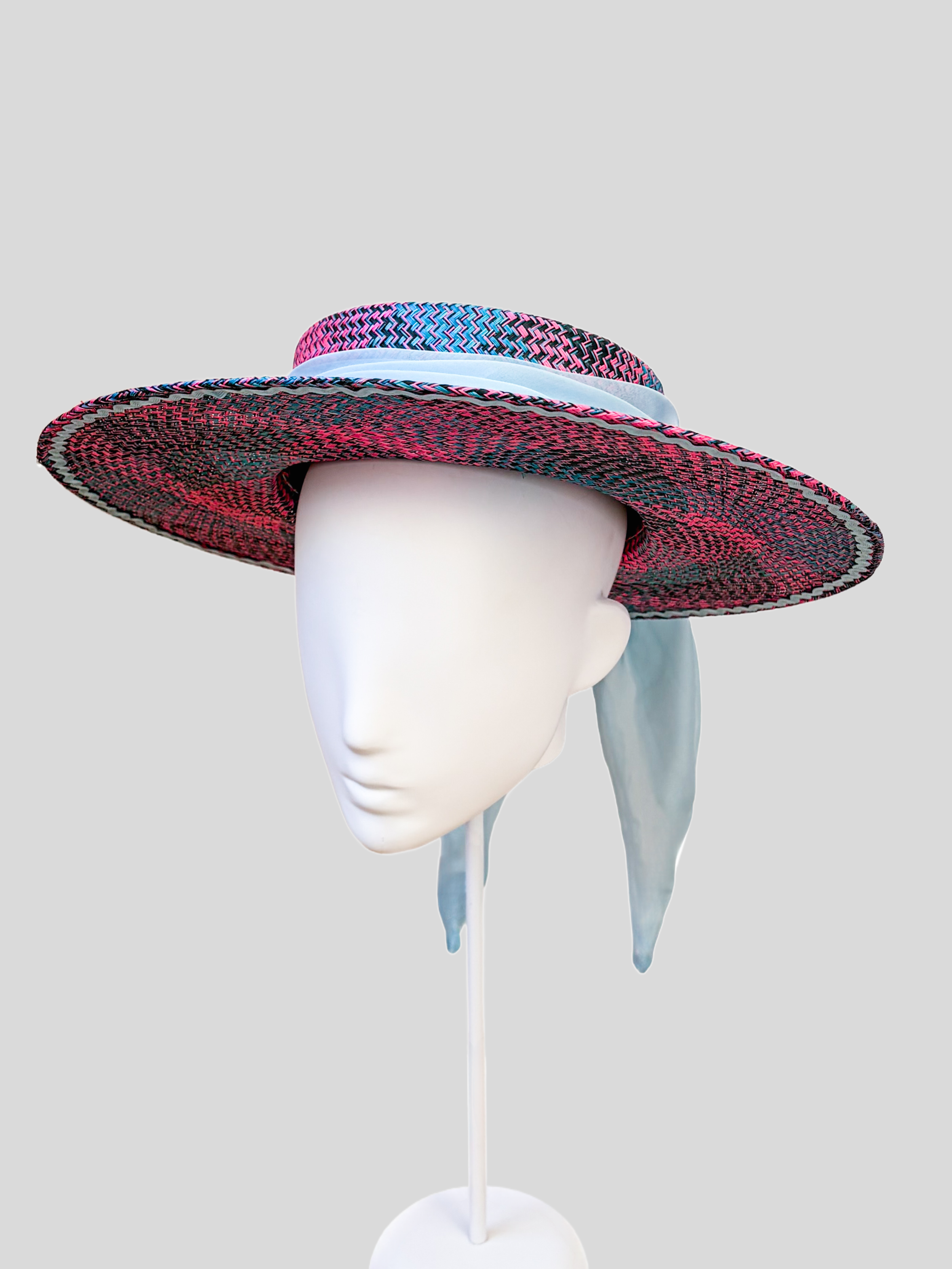 Solara Capri woven boater hat in fuchsia, turquoise and navy blue with a sky blue chiffon tie.