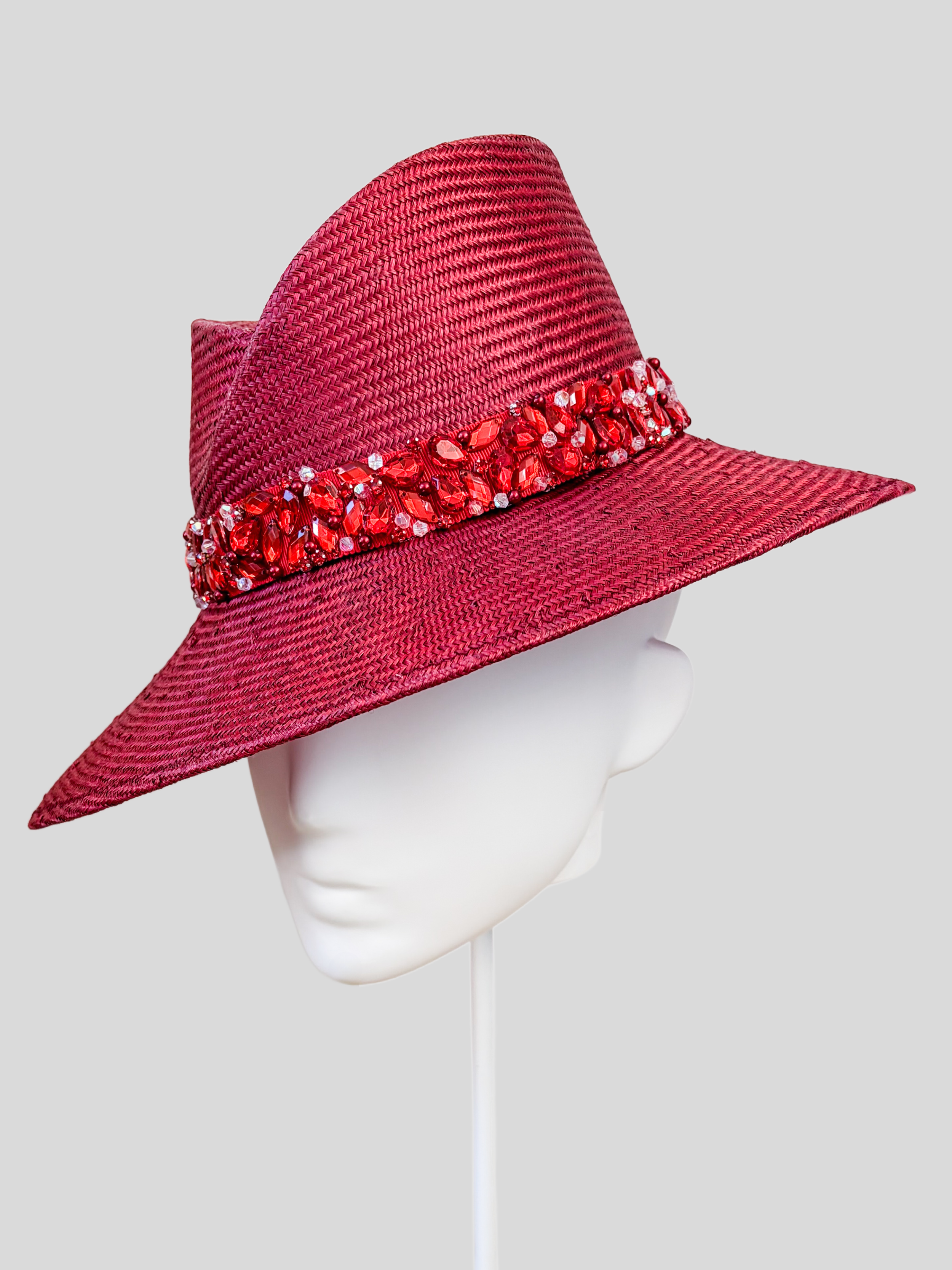 Close-up: Close-up of the hand-embellished red beaded and crystal-style band on the MAISON Ruby Parisisal fedora.