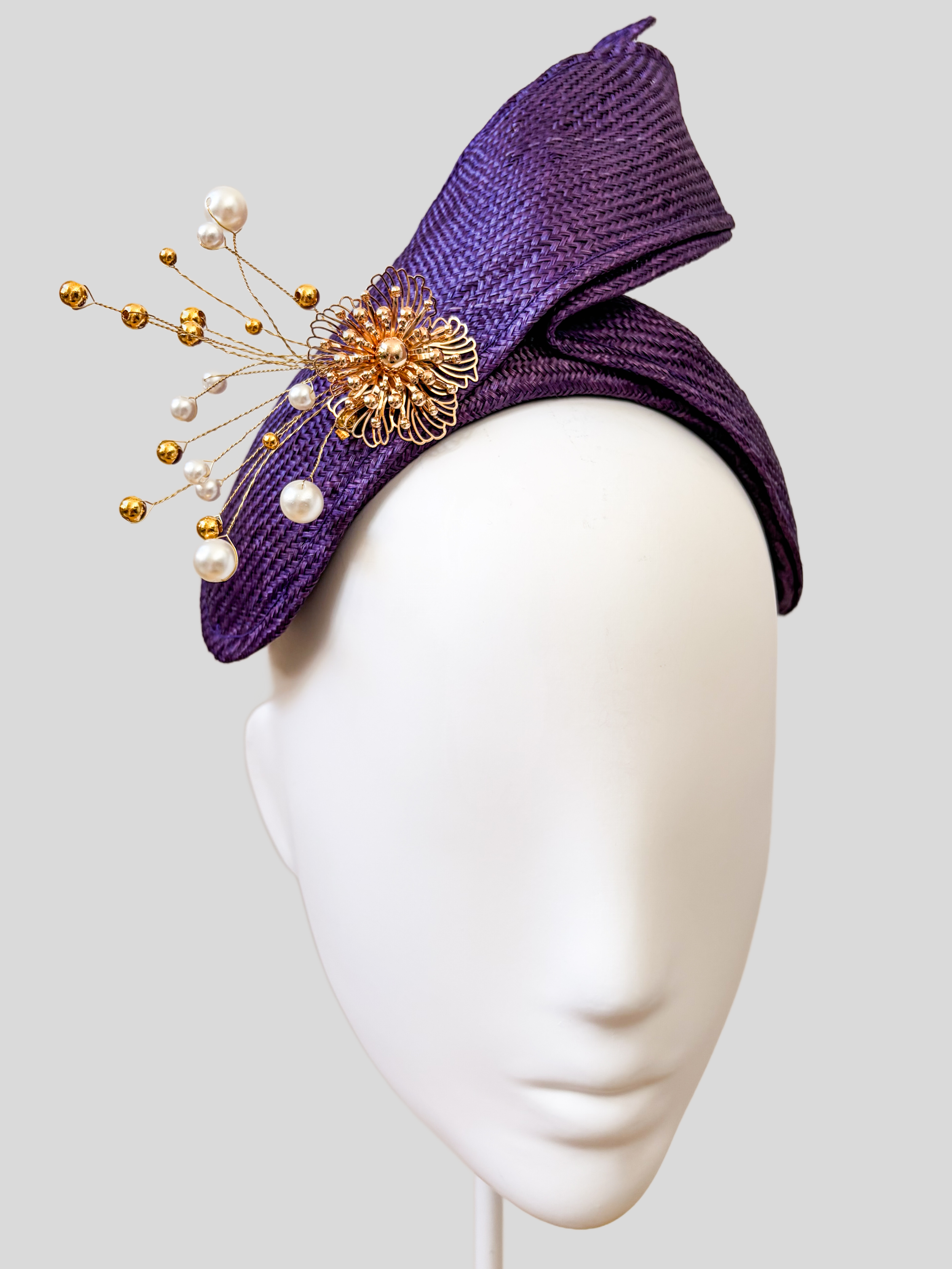 Close-up: Close-up of the hand-applied gold embellishment featuring pearls and delicate gold bead detailing on the SÉLÈNE Amethyst headband.