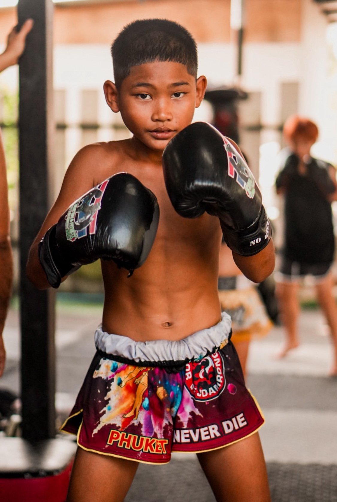 a young muay thai fighter training in phuket