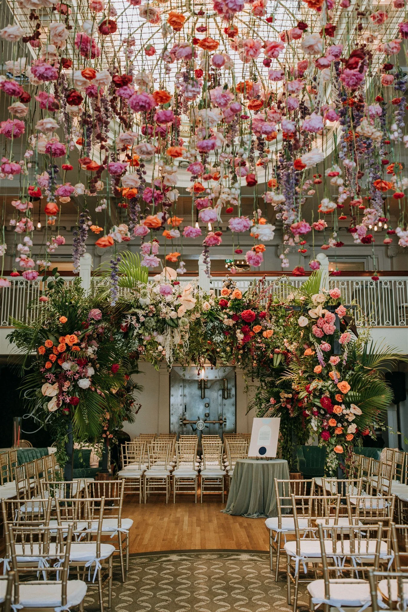 Hundreds of cascading flowers hung from the ceiling of The Permanent, in Vancouver, Canada, for the wedding.