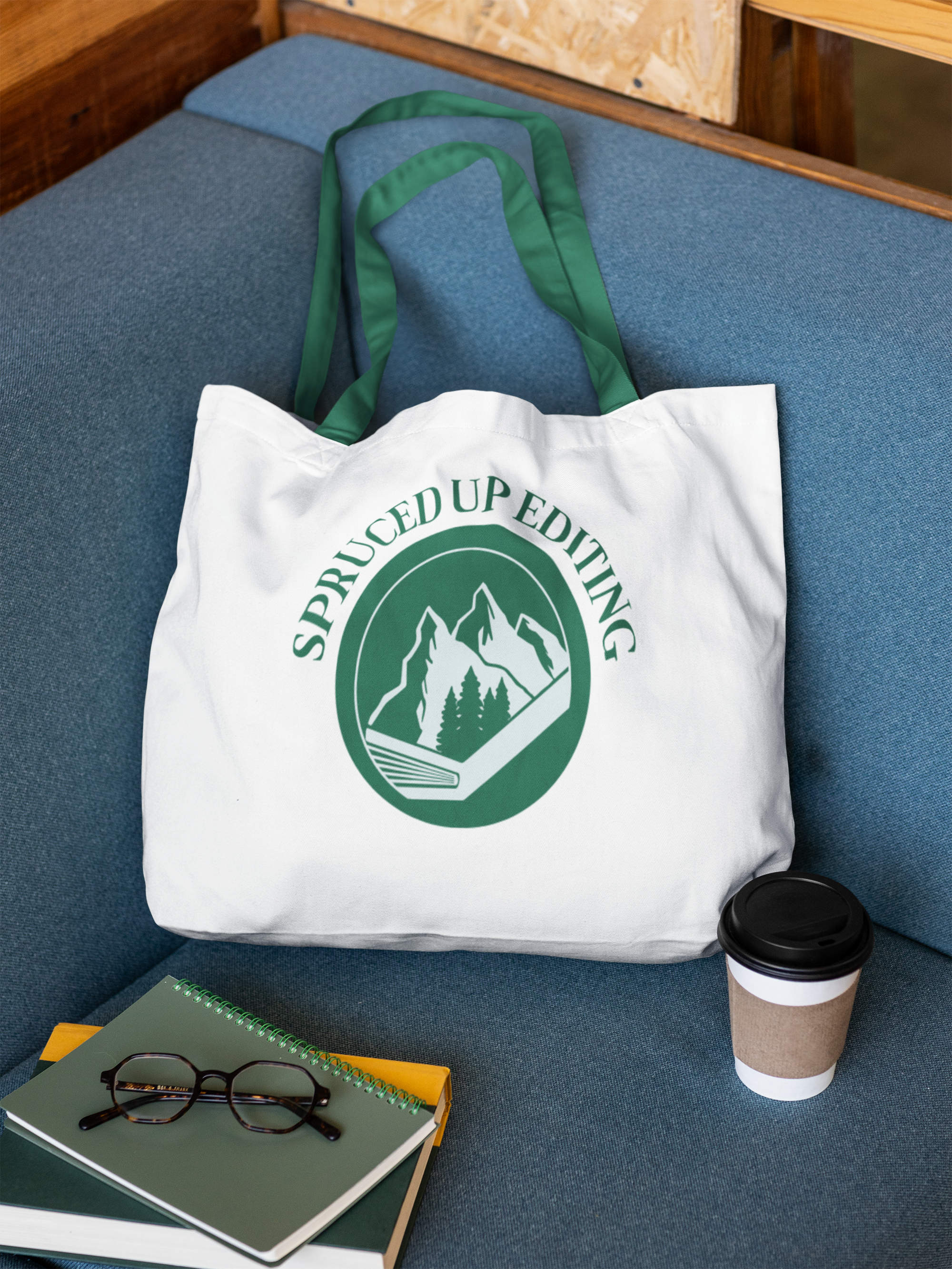 econscious-mockup-featuring-a-tote-bag-lying-on-a-couch-with-a-book-and-a-coffee-m56511.png