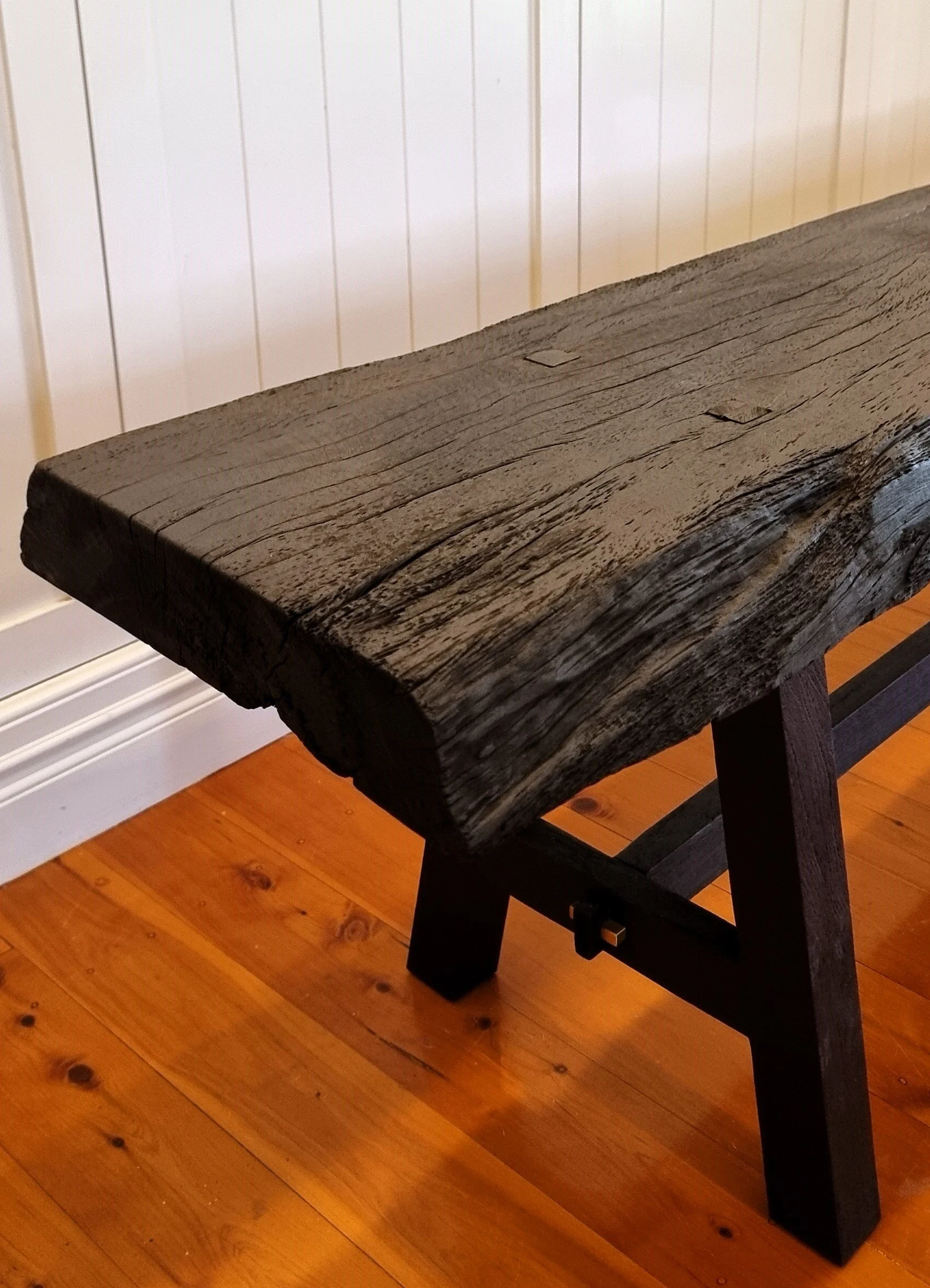 Currently available --
Bench made of burned New Guinea Rosewood with through tenons and brass details.