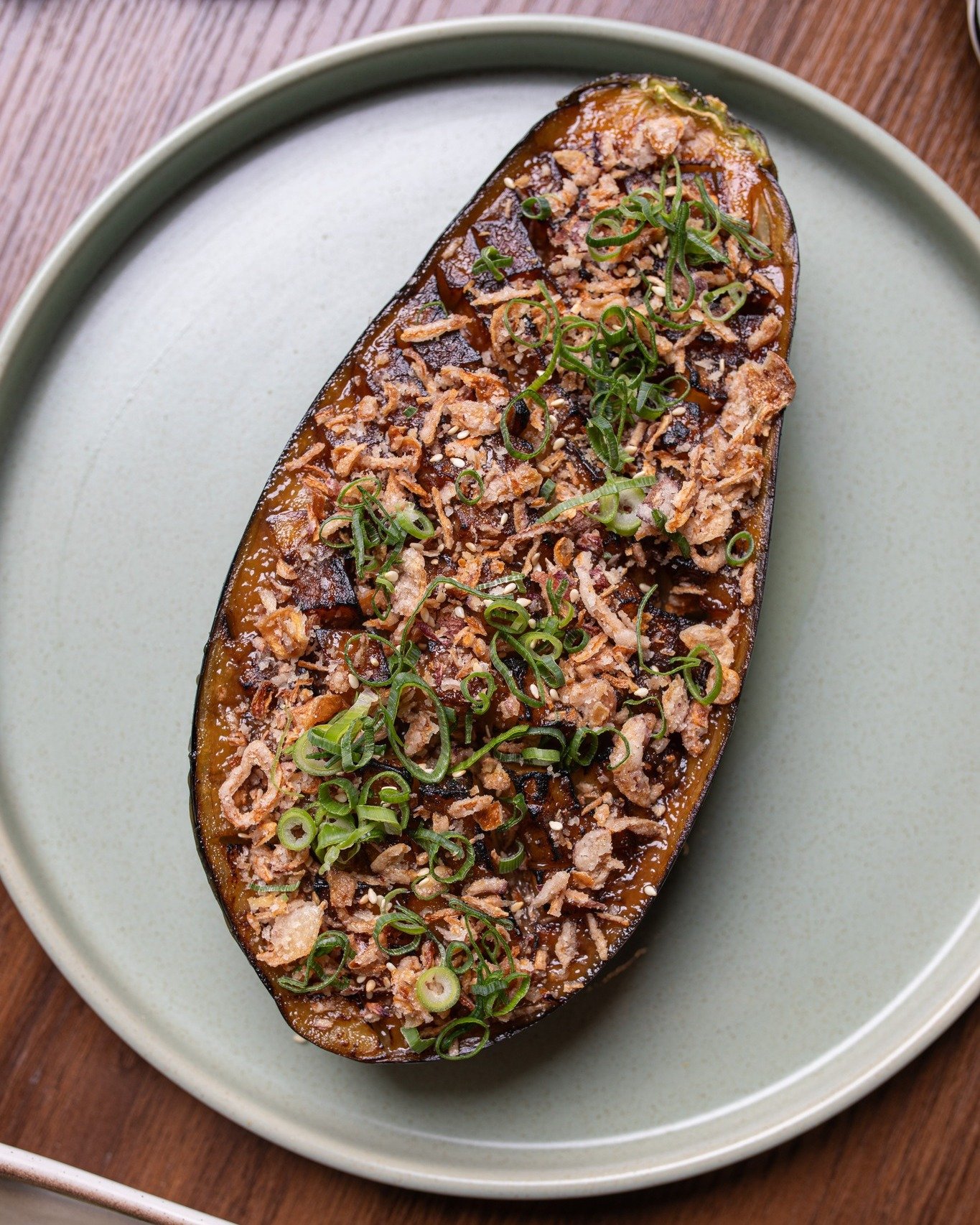 Elevate your eggplant game.

Delight in the smoky aroma and savoury flavours of our Grilled Eggplant, glazed with miso and topped with fragrant onion and shallot. It's a dish that's as delicious as it is satisfying.

#ChopChop #Canberra #Restaurant