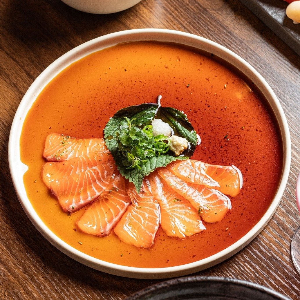 Salmon Carpaccio where tender slices of salmon meet the refreshing crunch of ginger and daikon, all harmonised with a zesty lime ponzu.

#ChopChop #Canberra #Restaurant