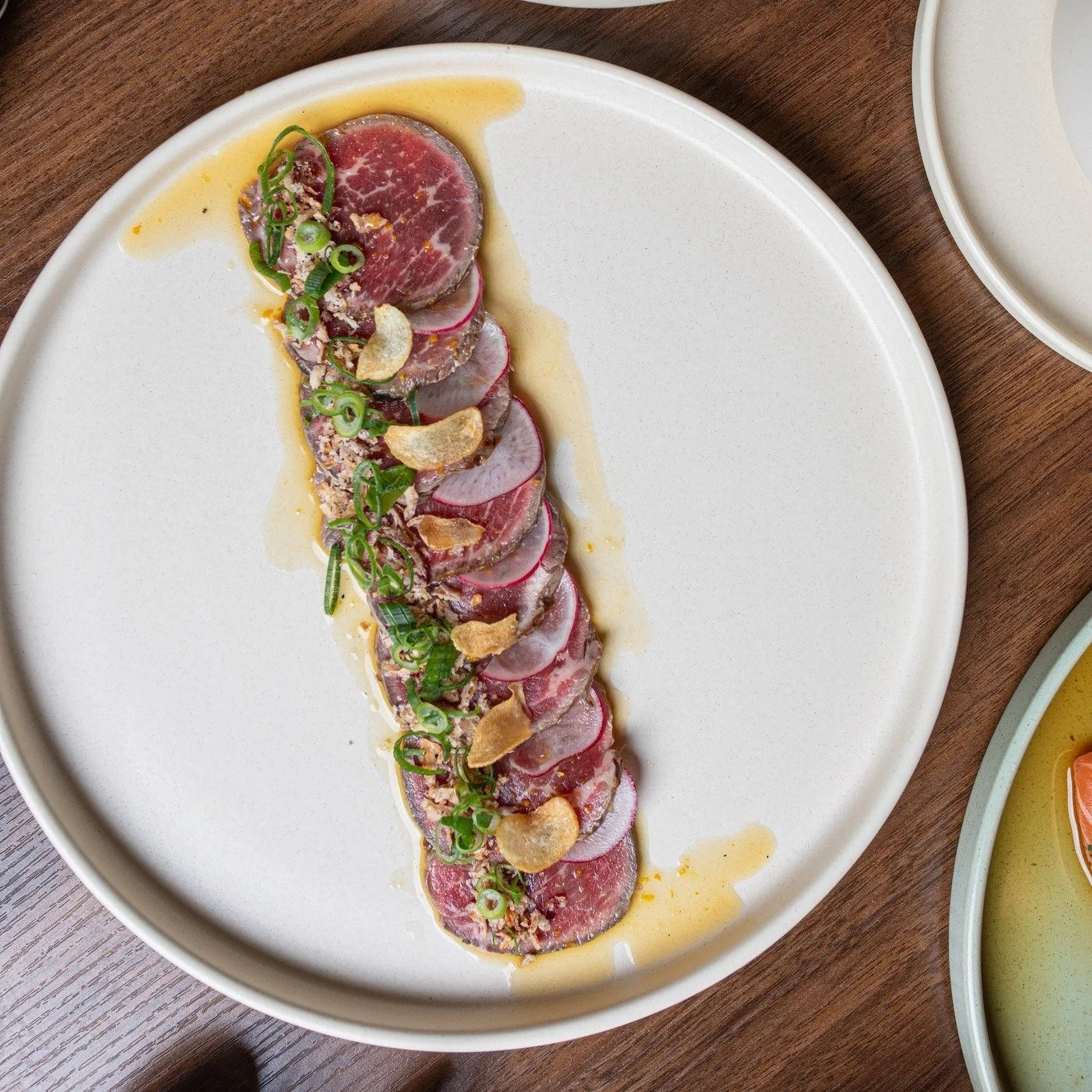 Get ready for a flavour explosion with our Wagyu Tataki! Juicy MSB6+ Wagyu beef, and served with a kick of tangy orange ponzu and crispy onion. 

#ChopChop #Canberra #Restaurant