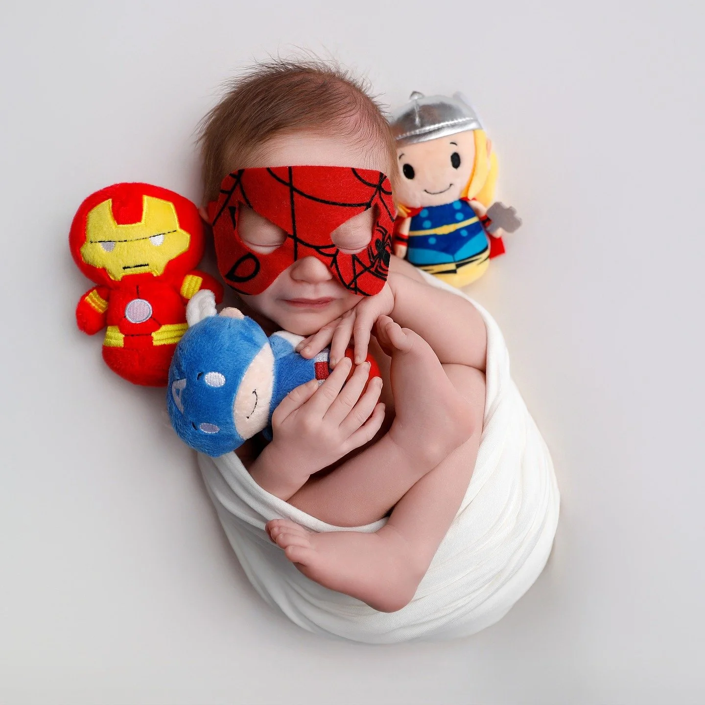 Wrapped in love and guarded by the cutest squad &mdash; Iron Man, Cap, and Thor &mdash; this tiny Spidey is ready for big adventures. ❤️💙💛
#BabyHero #LittleAvenger #NewbornPhotography #Superbaby #TinyButMighty #MarvelBaby #CutestSuperhero