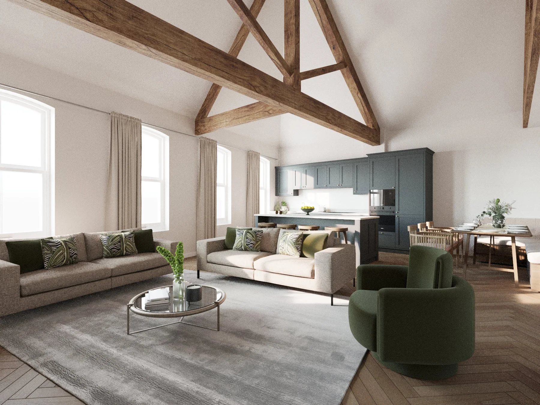 Bright open-concept living room with beige sofas, green accent chair, coffee table, and a kitchen with blue cabinets and a dining area in the background. Wooden beams on the ceiling and large windows with curtains.