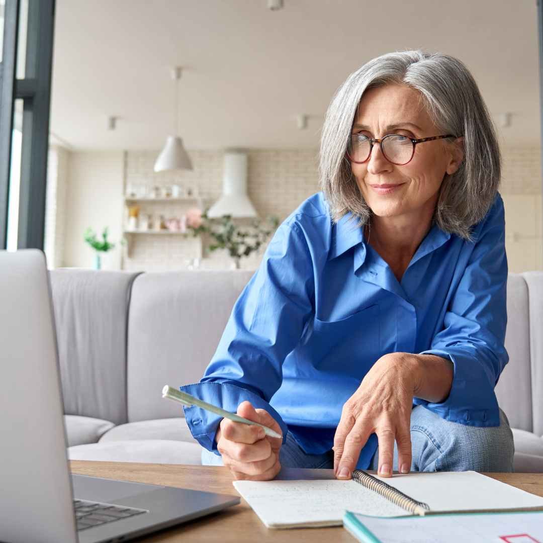 Senior on Laptop Doing Research
