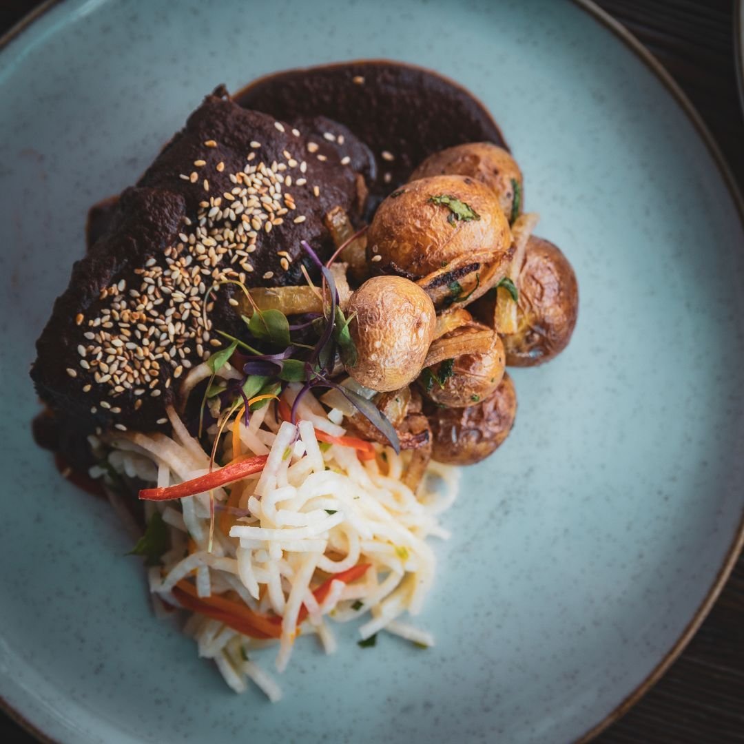WHAT'S FOR DINNER: Costillas Poblanas 🤌
Mother Reyna&rsquo;s mole-braised short ribs with roasted garlic-epazote potatoes and jicama slaw. Pair with a nice glass of our Adobe Guadalupe Jardin Secreto Mexican red wine to round out your dining experie