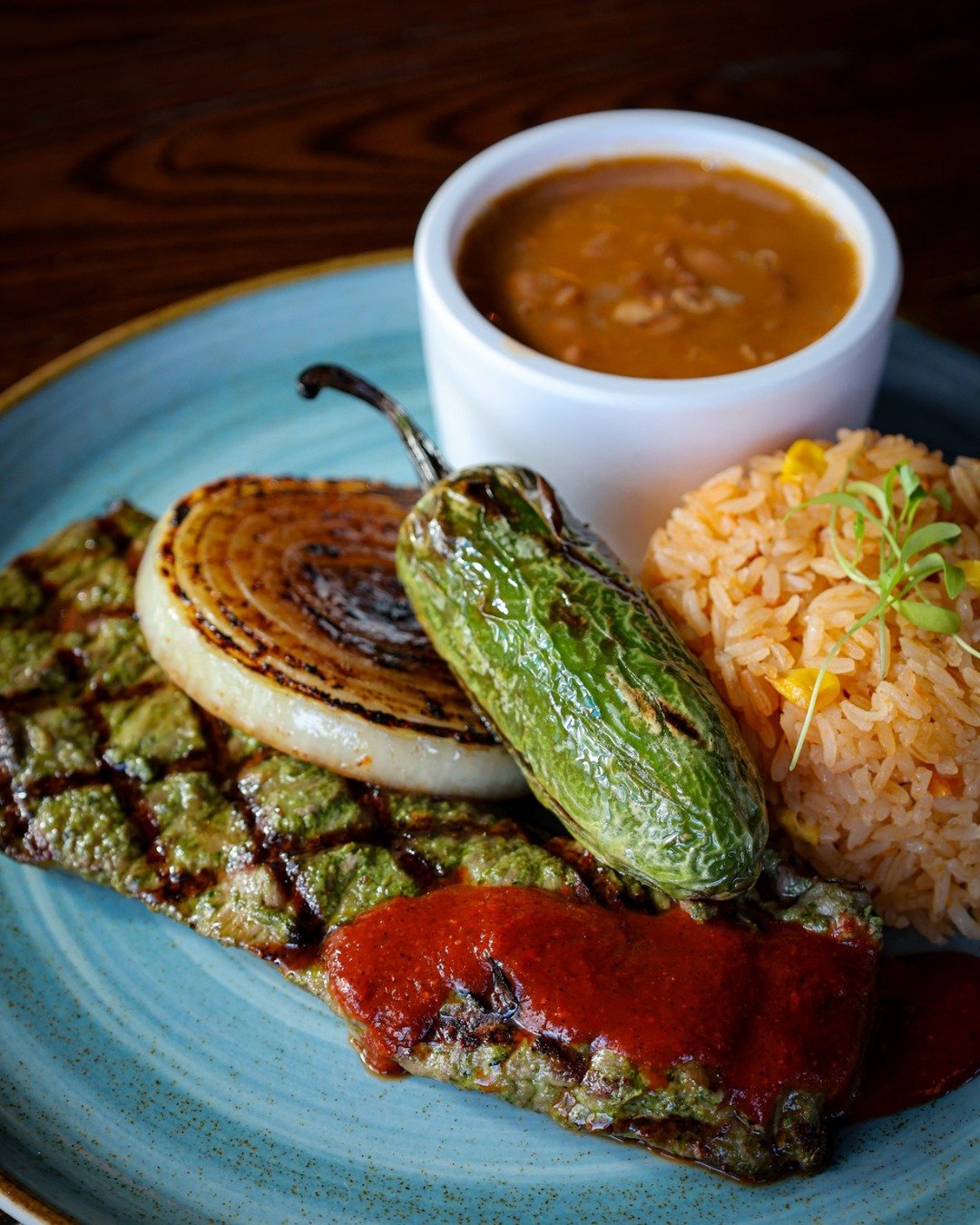 Your next must-try: Carne Asada.
10oz chimichurri-marinated skirt steak, salsa de guajillo, rice, charro beans, chile toreado, and warm tortillas.
Book your reservation now on OpenTable.