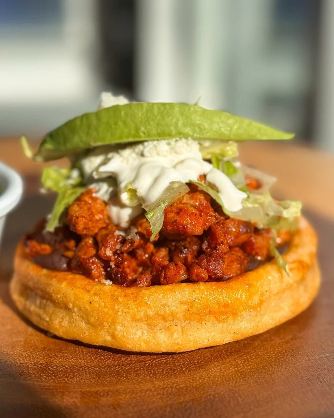 Ordering online? Add Sopes.
Hand-crafted corn patties topped with black beans, queso fresco, crema, avocado, lettuce, and your choice of meat.

Available exclusively for online ordering.