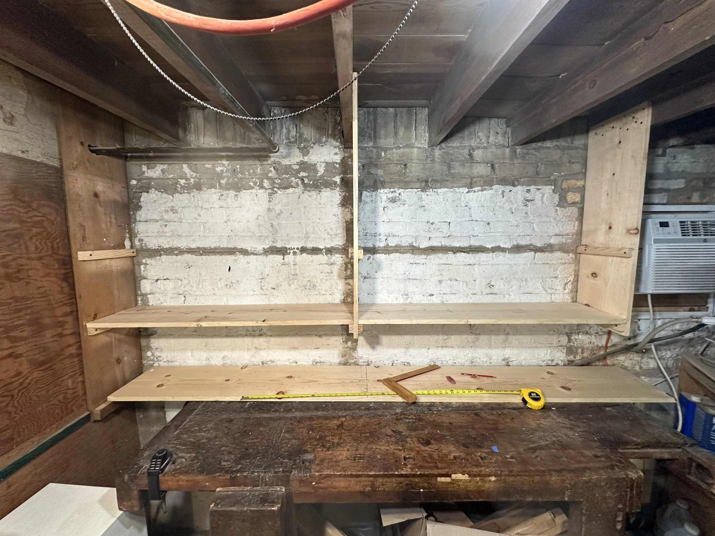 My center board was hard to align properly, so I measured for the gap and cut a shim with a band saw. I screwed all of my boards into the handmade brackets I fashioned earlier. 
