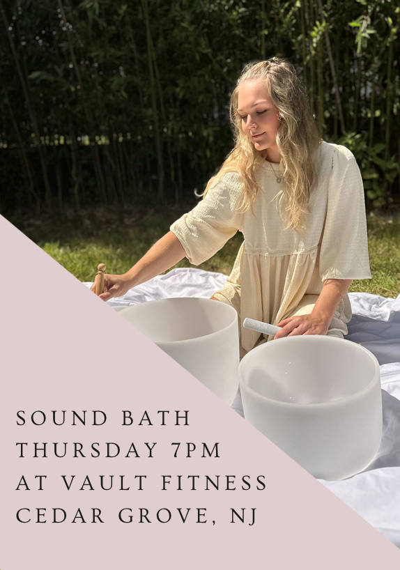 A young girl with long blonde hair playing crystal singing bowls outdoors on a white blanket, with greenery in the background. Text overlay promoting a sound bath event on Thursday at 6 PM at Vault Fitness.
