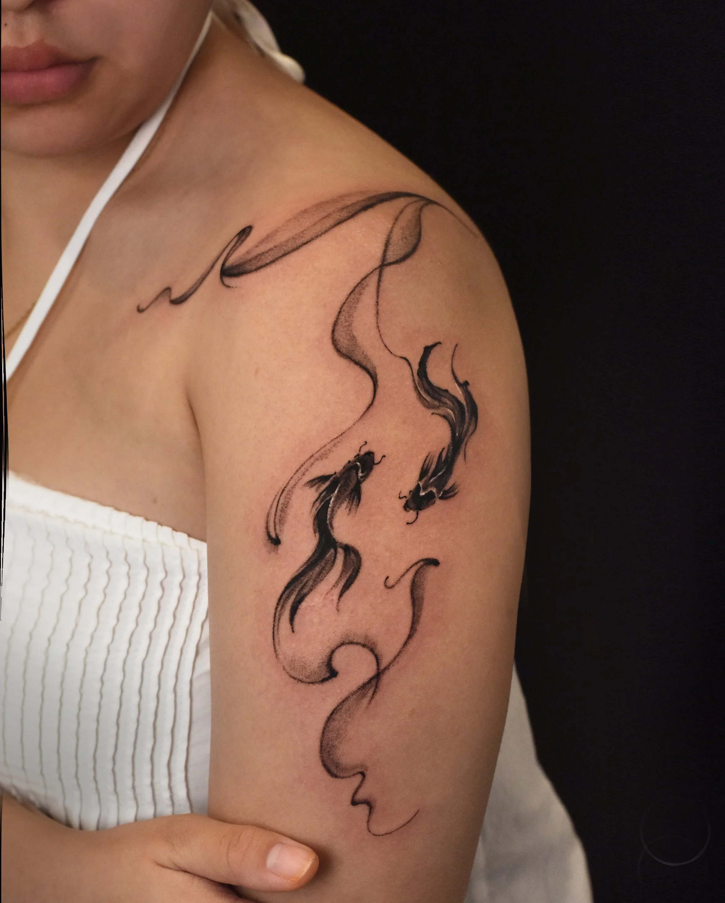 Koi tattoo in smoke, brush stroke style, minimal but bold, design and crafted by just good type tattoo, based in Los angeles