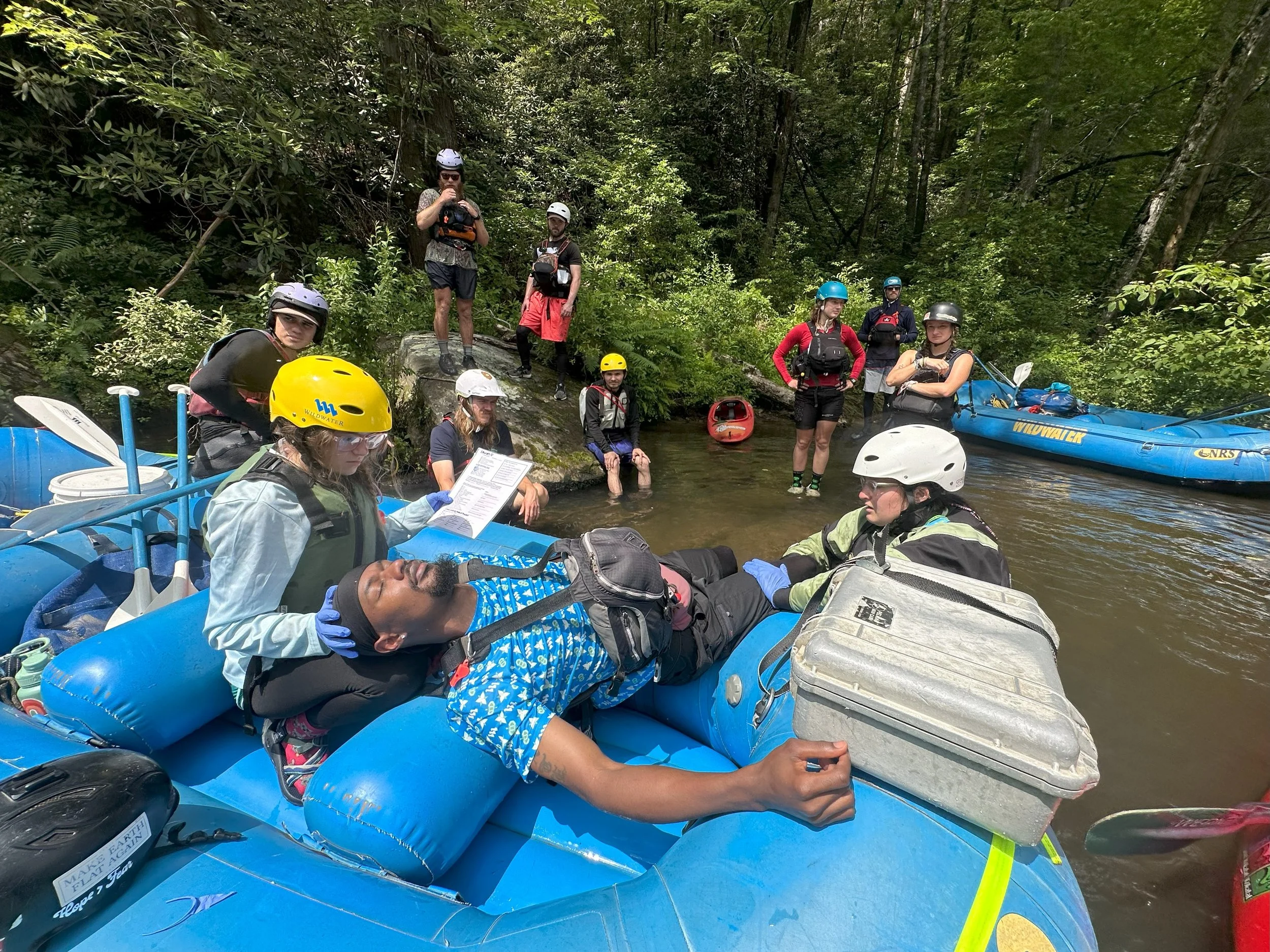 Wilderness Medicine Training. WFA certification. Wilderness medicine society. how to care for an unconscious patient in the wilderness. raft guides learning emergency medicine Resusci-taters wilderness emergency medicine training