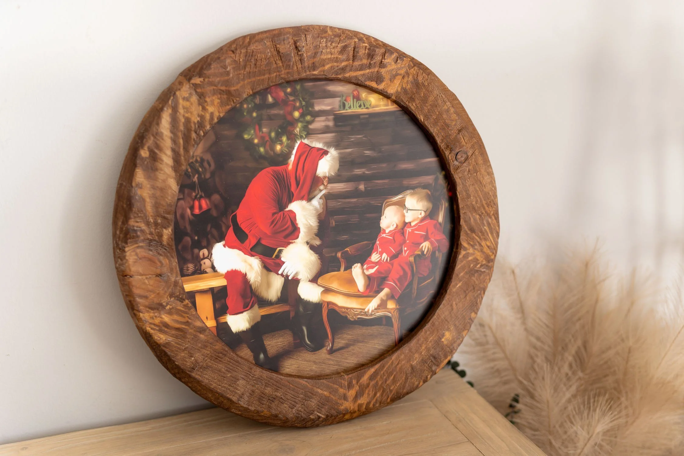 Round wooden Santa portrait displayed as custom holiday wall art.
