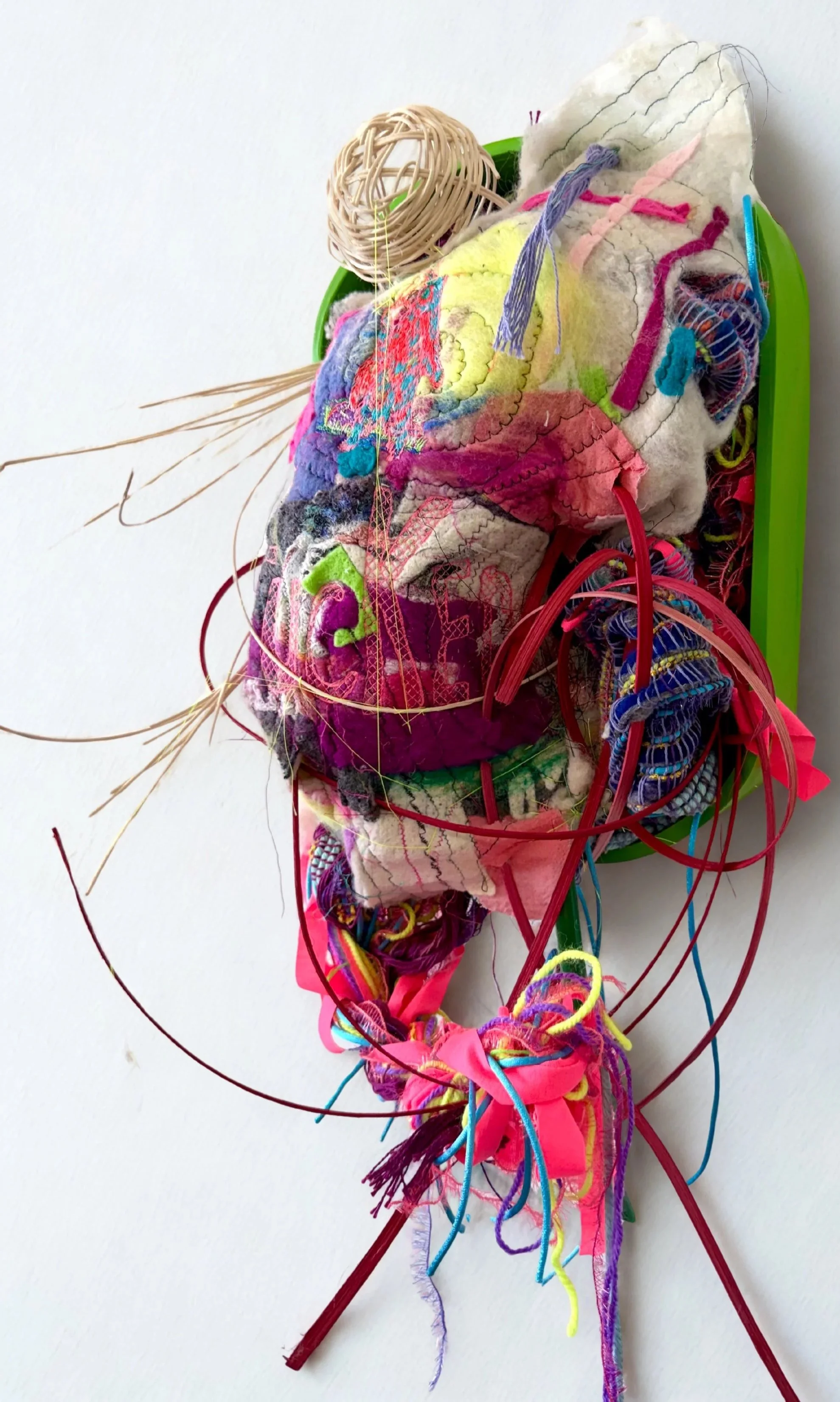 Emily Silver|Side Pony (side view)|2026|Wood, reed, cotton, wool, acrylic, embroidery|20x16x8 Inches