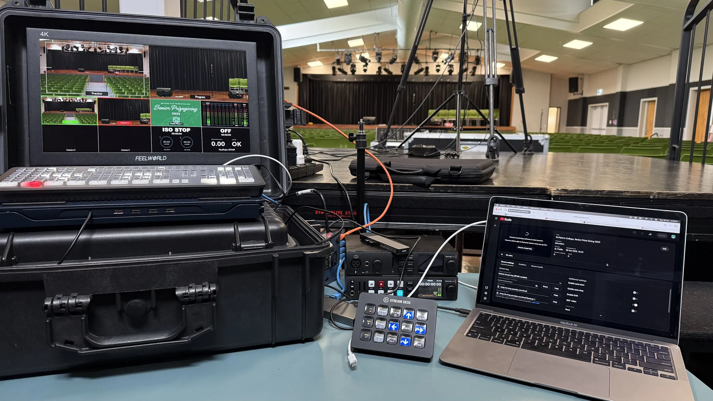 Blackmagic Design ATEM SDI Extreme ISO video switcher with associated live streaming equipment setup in a school hall for a prize giving live stream