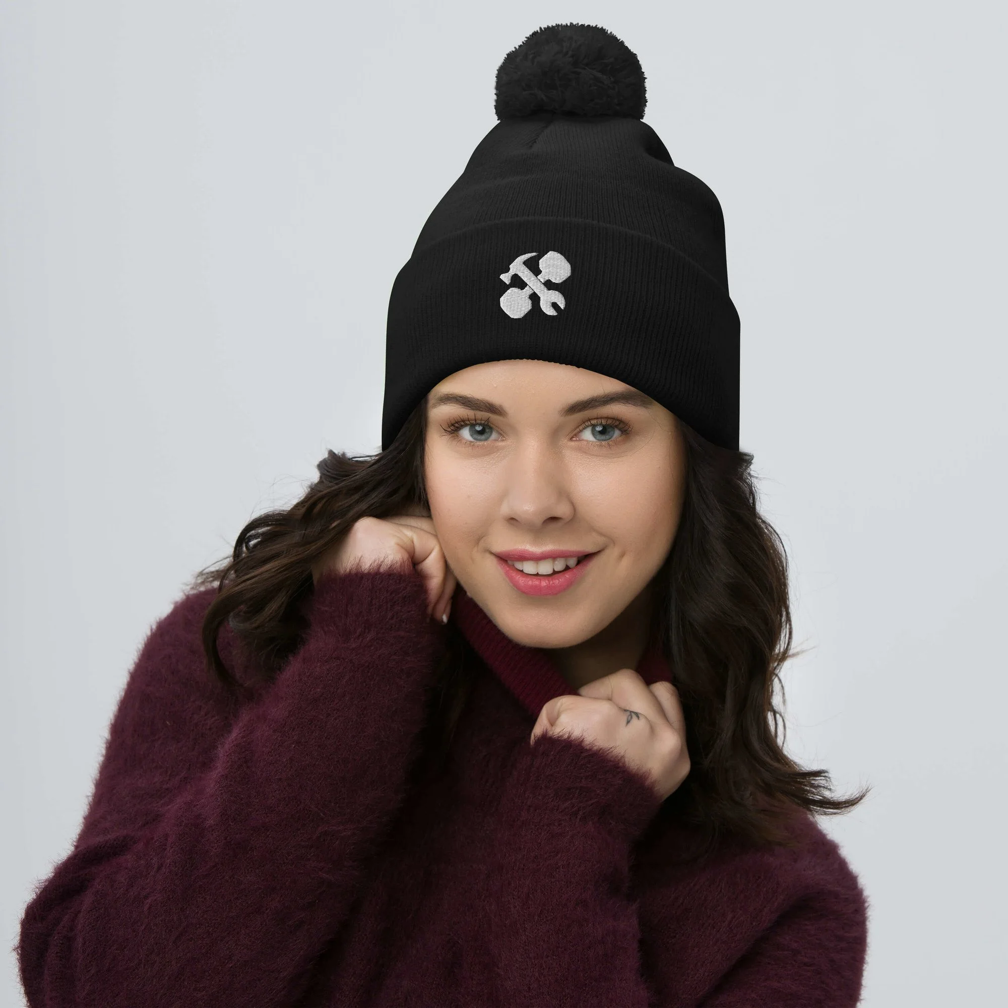 pom-pom-knit-cap-black-front-65a1488c5e4f6.jpg