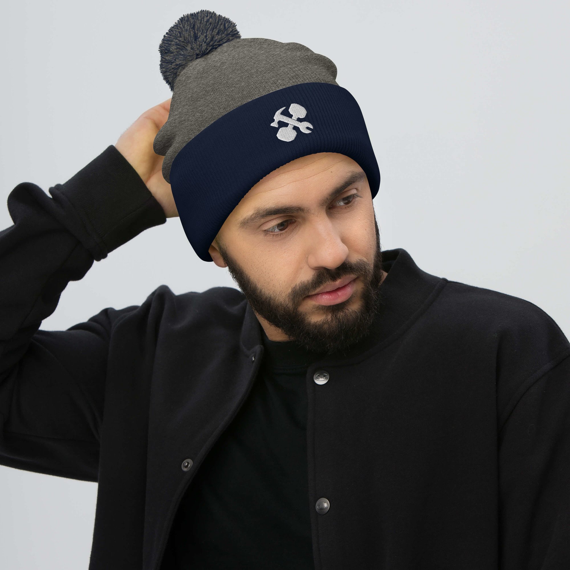 pom-pom-knit-cap-dark-heather-grey-navy-front-65a1488c5ed3e.jpg