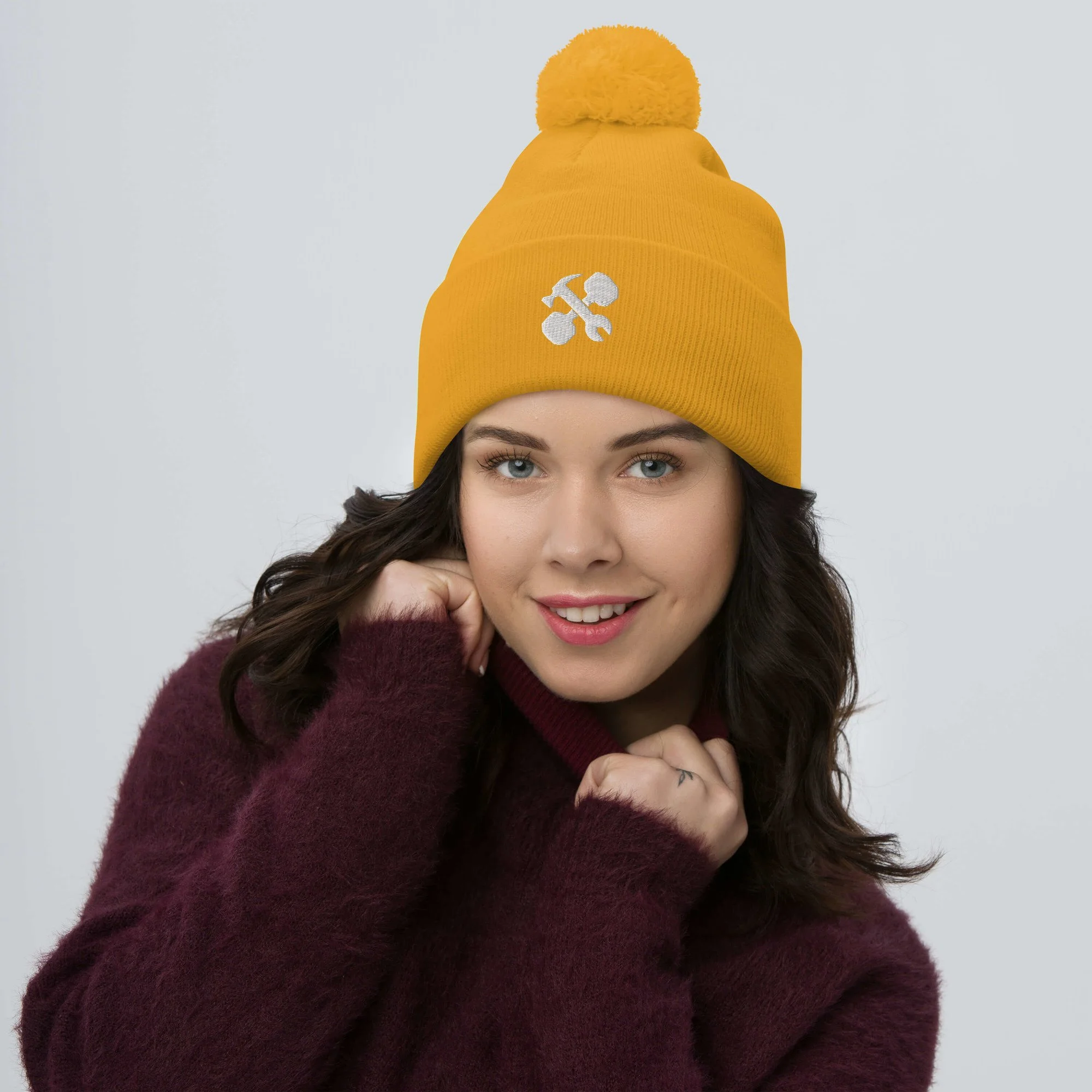 pom-pom-knit-cap-gold-front-65a1488c5f3a0.jpg