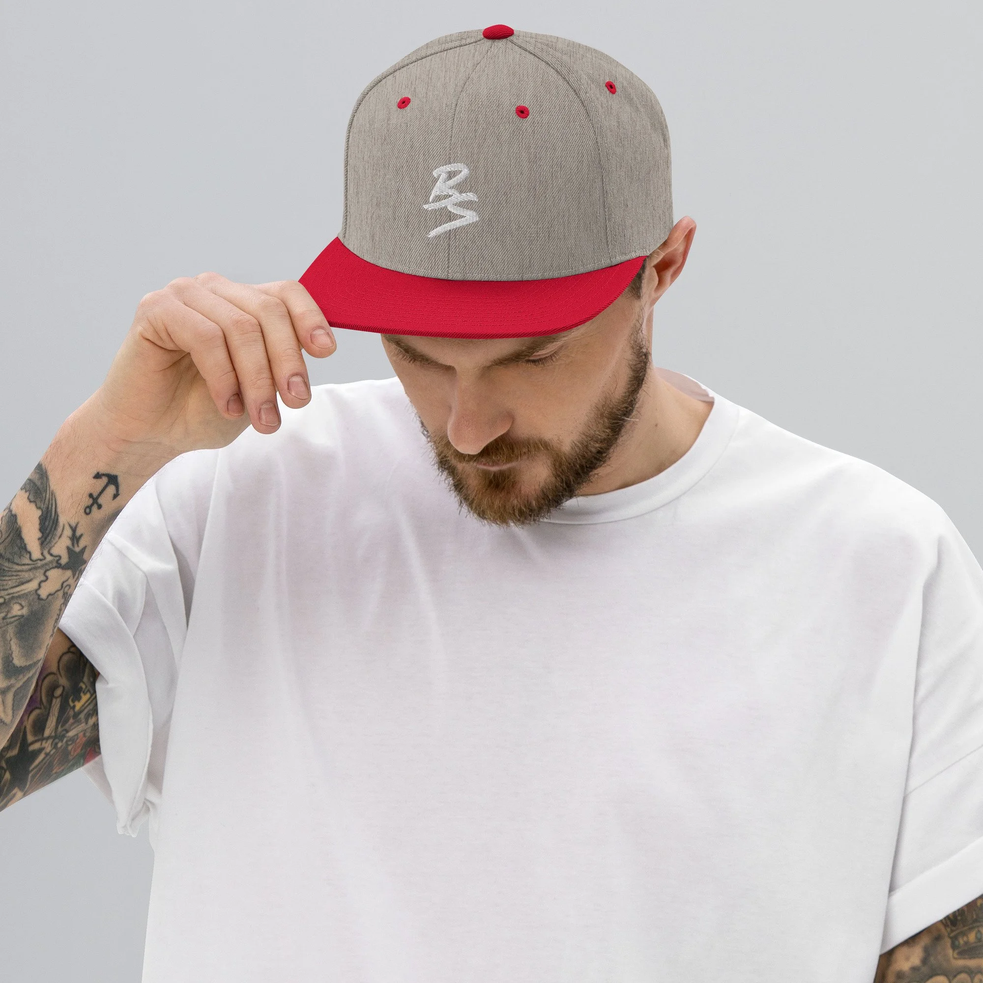 classic-snapback-heather-grey-red-front-65a4331a72c47.jpg