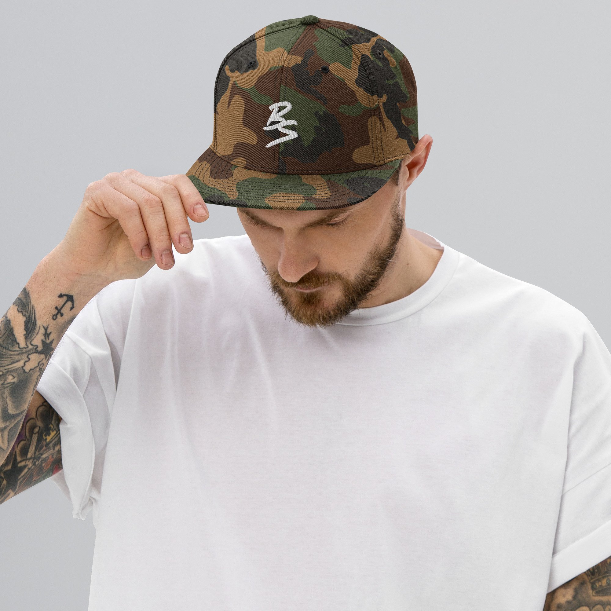 classic-snapback-green-camo-front-65a4331a755fb.jpg
