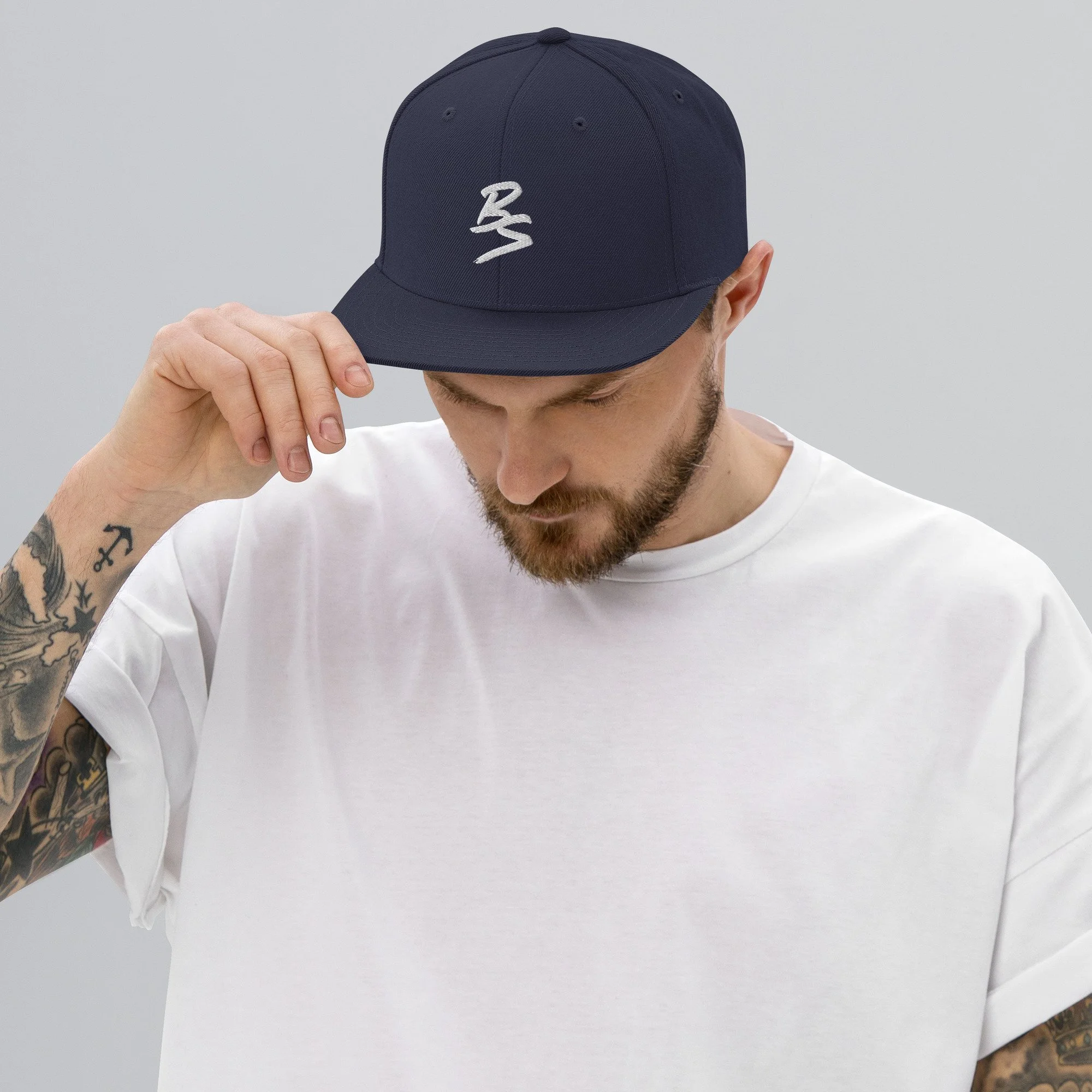 classic-snapback-navy-front-65a4331a77104.jpg