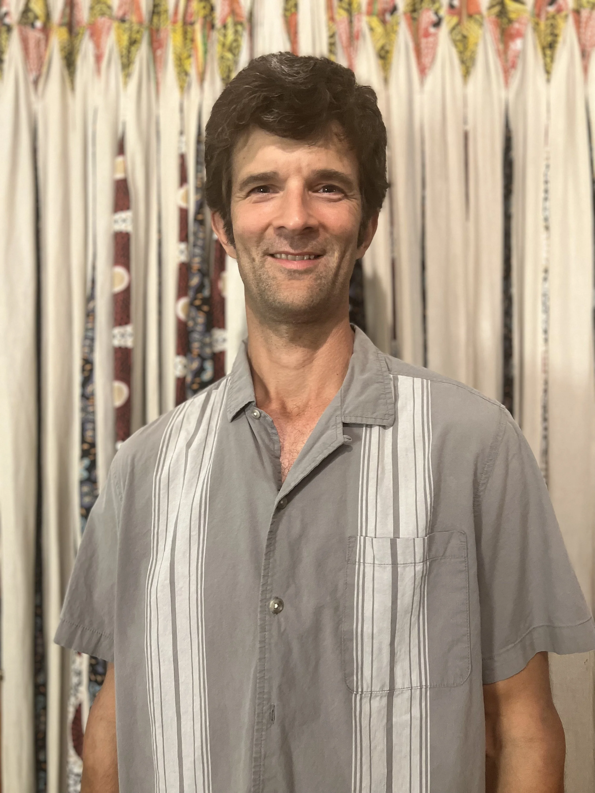tall white man curly hair founder of company 