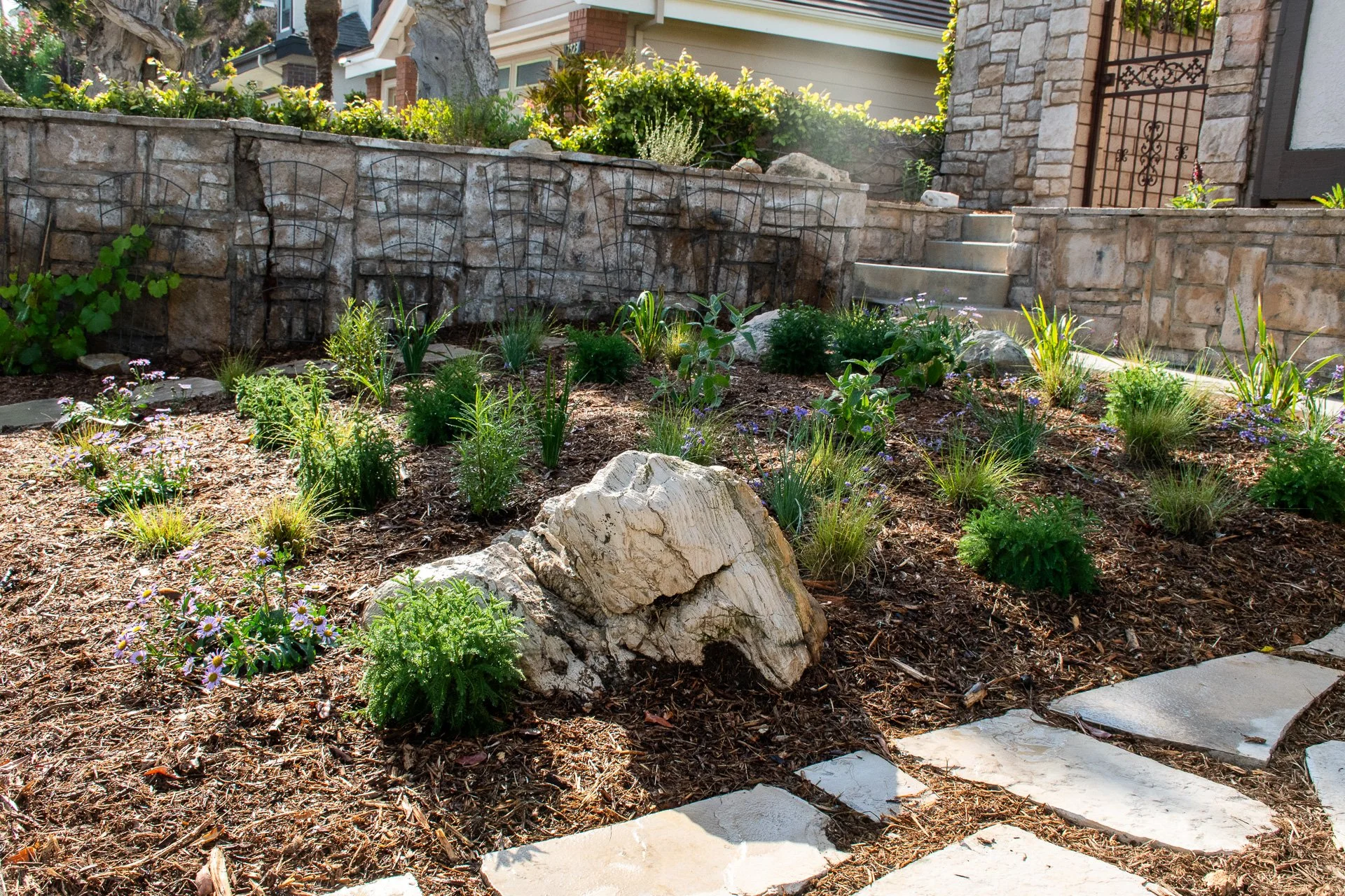 Installation Day: A fair amount of rock and boulder was unearthed during demolition; rather than hauling it to the dump, we reused it as decoration.