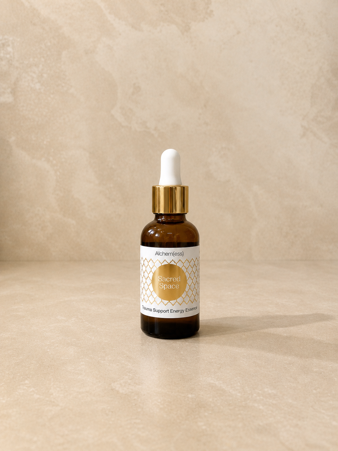 A small amber spray bottle with a black pump and a white label that reads 'Alchem{ess} Support Essence PURIFY, supporting mental and emotional purification.'