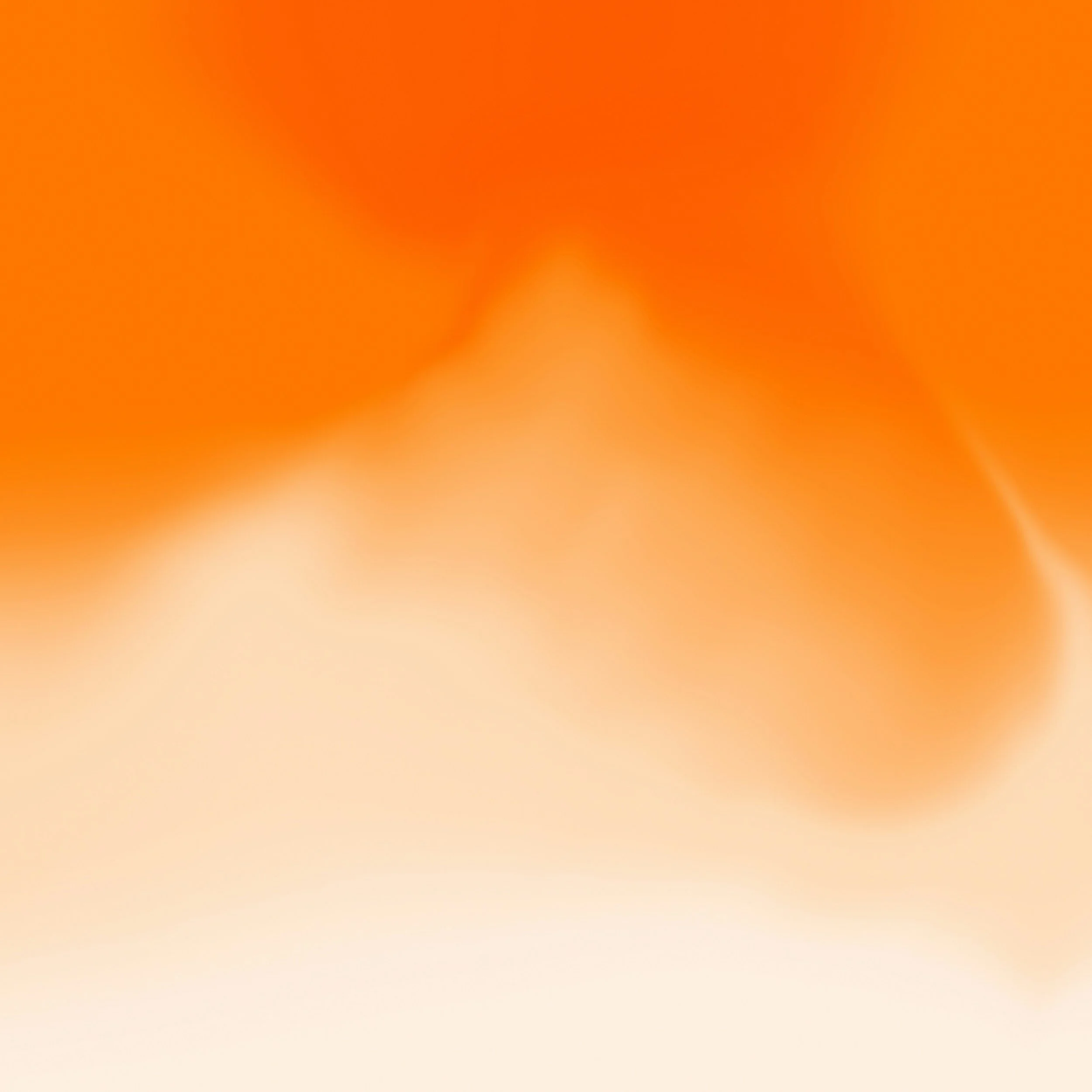 Abstract gradient background with warm orange and cream colors.