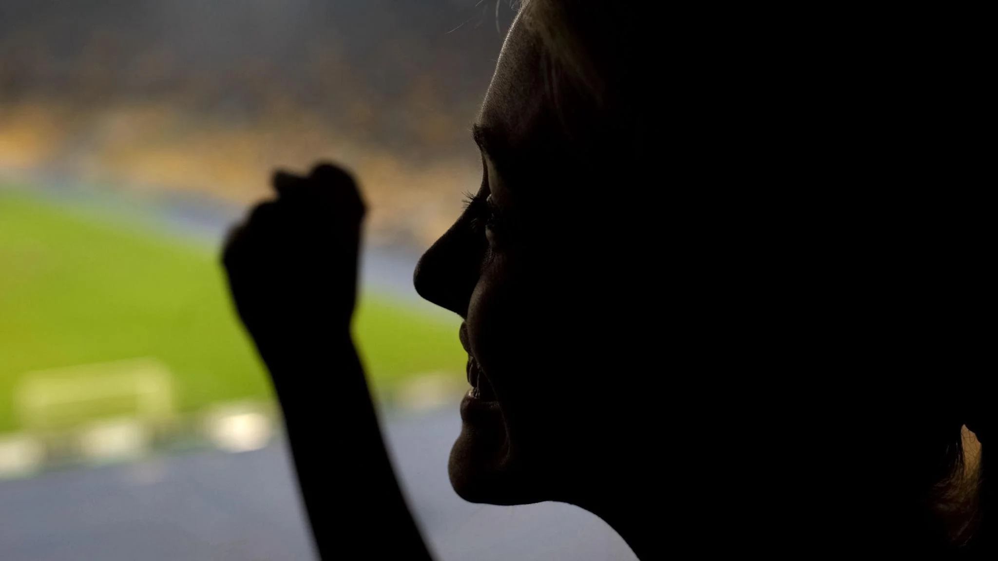 Happy woman fan cheering for football team winning on crowded stadium, emotion - standing against abuse - abuse is not part of any game