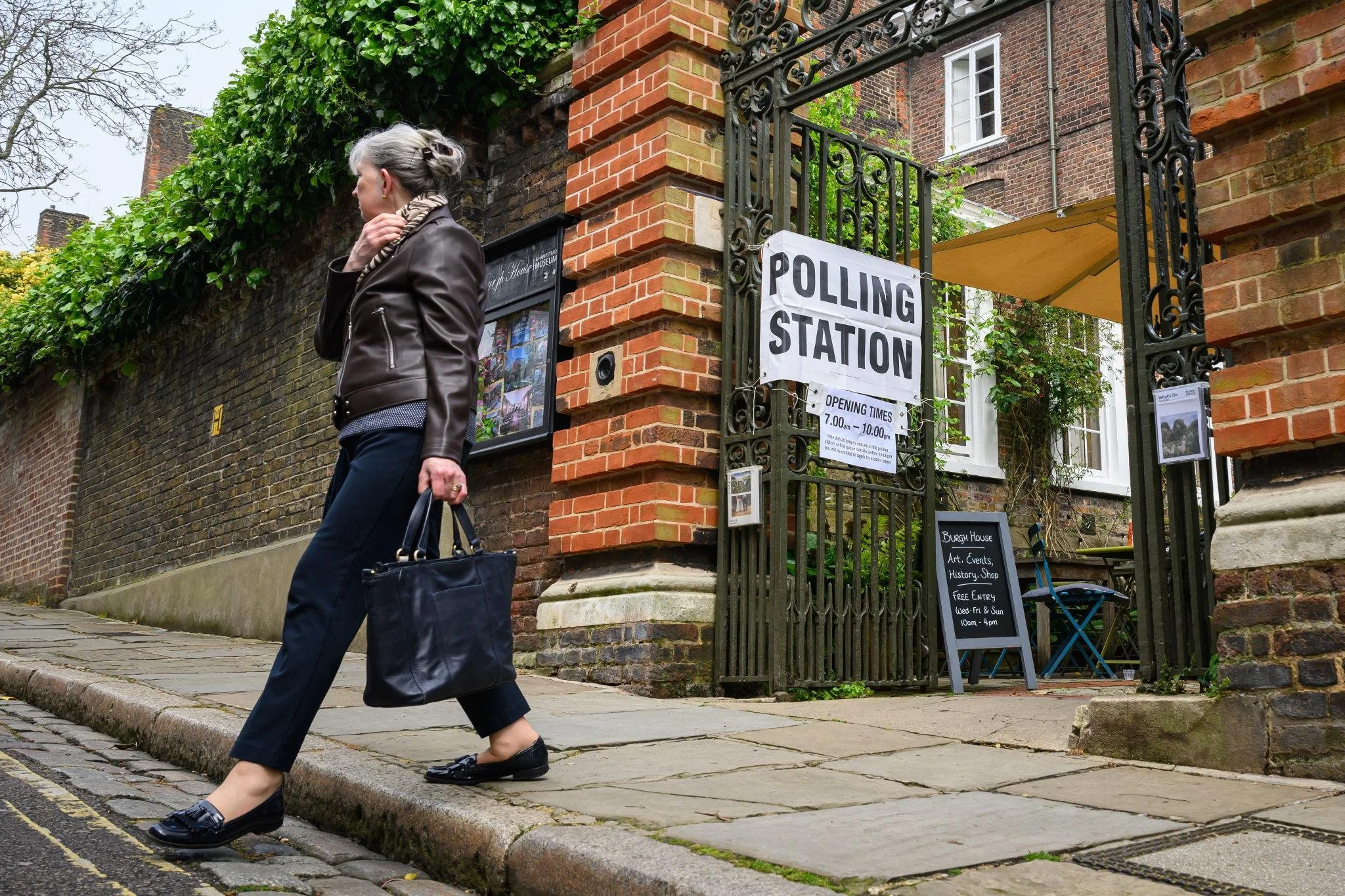 Voter leaving a UK polling station after casting their vote, representing participation in local elections and civic engagement in the community.