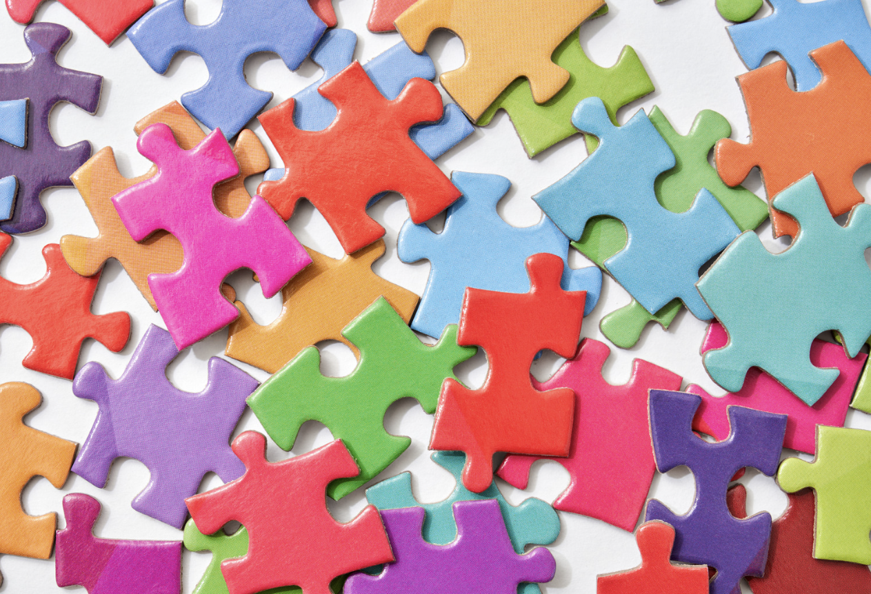 Colourful jigsaw pieces representing organisations working together to map community safety and other local assets